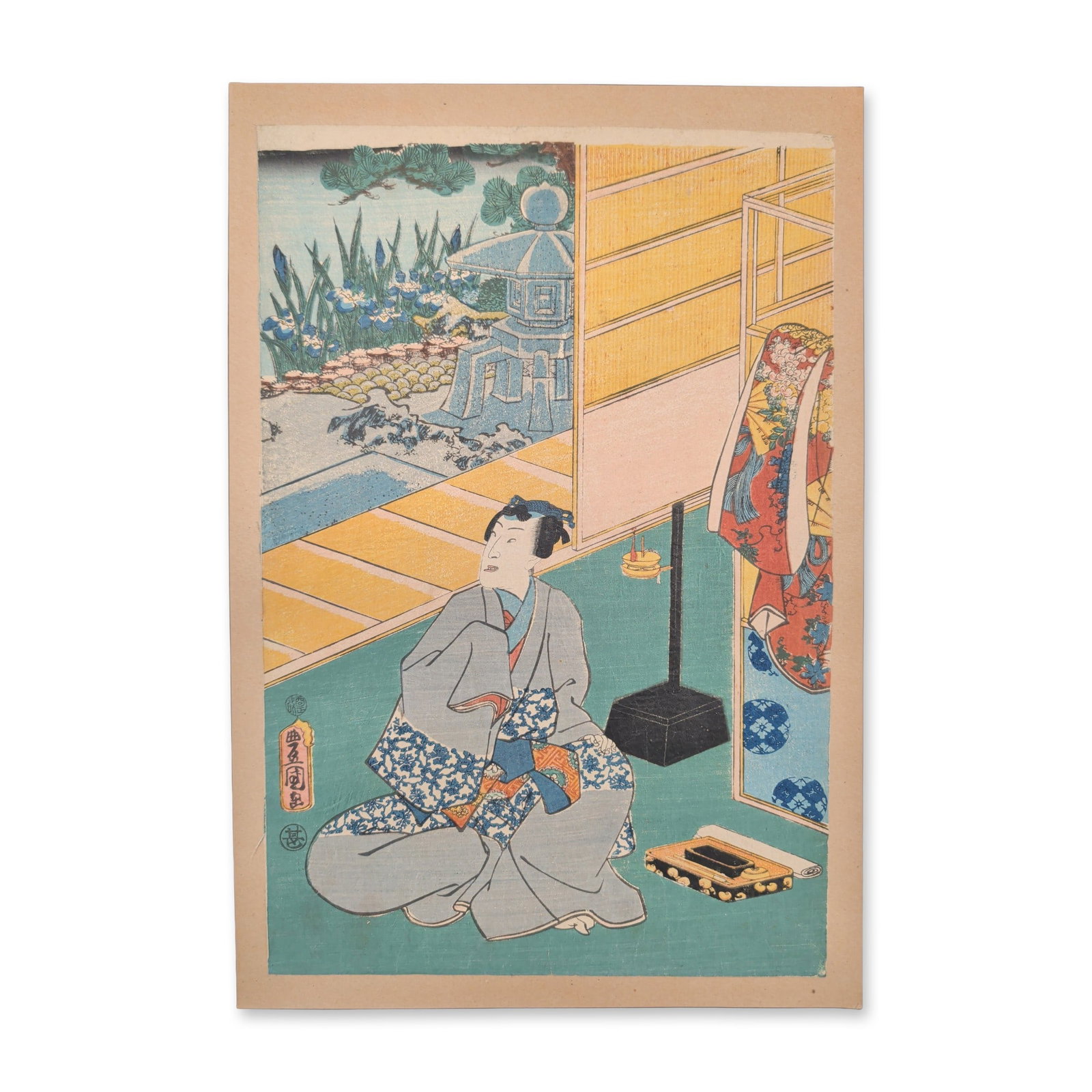Utagawa Kunisada (Toyokuni III) (Japanese, 1786-1865) Woodcut from the series One Hundred Famous: A central male figure clad in an elegantly patterned grey kimono sits cross-legged on a traditional tatami-matted veranda, gesturing toward a lacquer writing set on the floor beside a freestanding flo