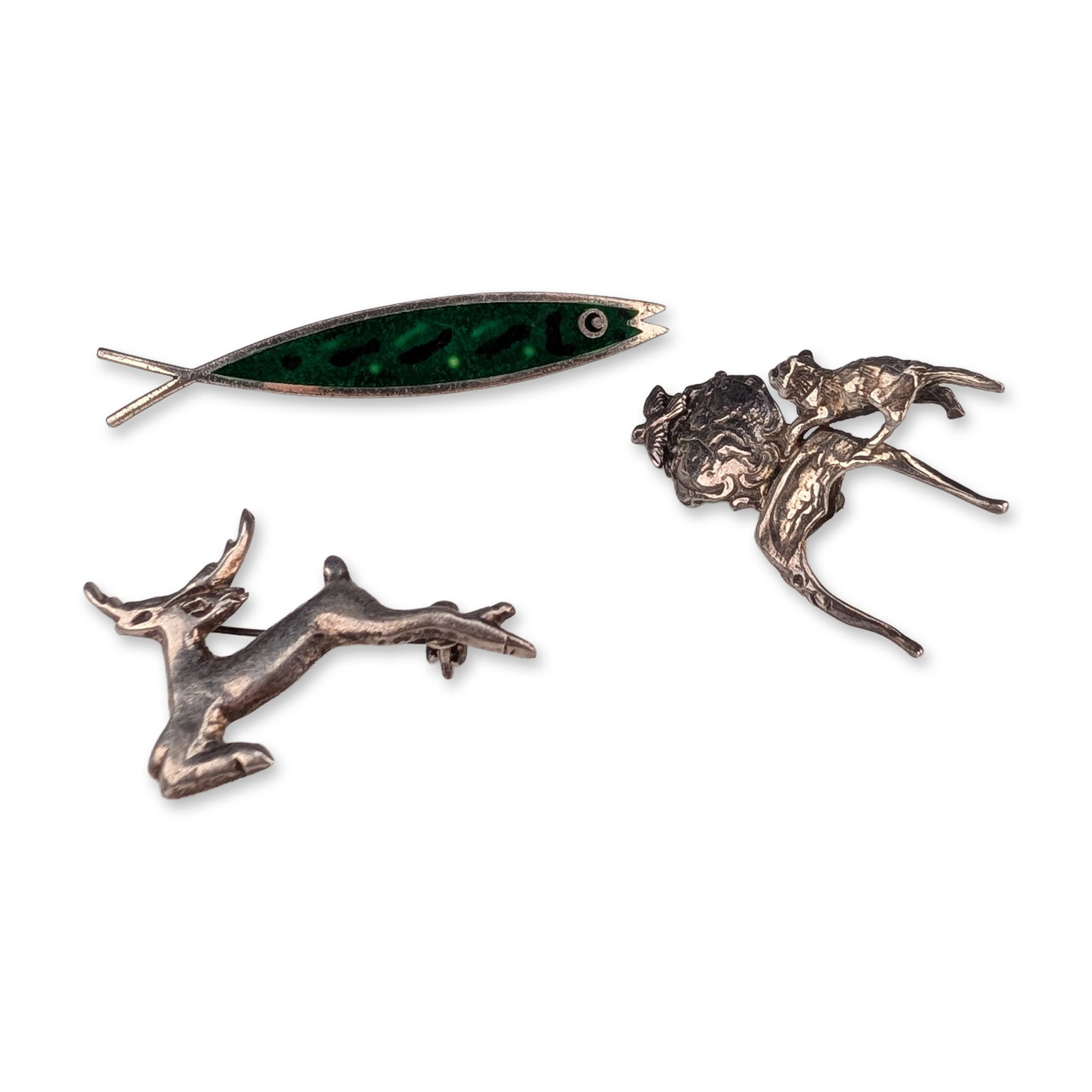 3pc Sterling Silver Animal Brooches: Trio of mid-century animal-themed sterling silver brooches. Stylized fish brooch by Beaucraft featuring translucent green enamel with dark accents, stamped BEAU STERLING on the reverse. Leaping deer b