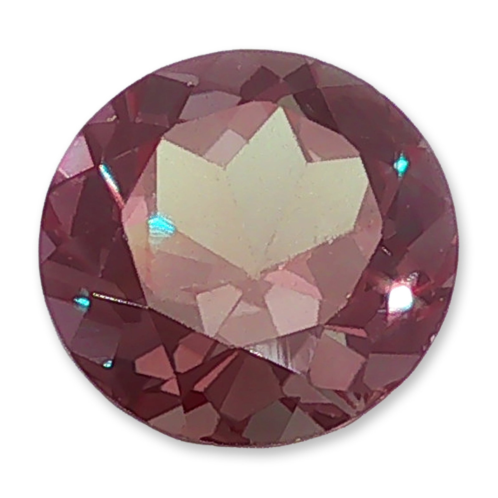 Round Cut Loose Alexandrite Gemstone: Round brilliant cut loose faceted gemstone, appearing to be alexandrite. This loose gemstone showcases a round cut that highlights its unique color-changing properties. The stone displays a rich