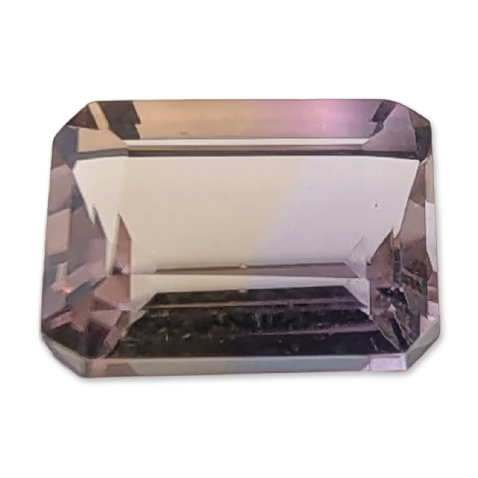 Emerald Cut Ametrine Gemstone: Loose faceted gemstone that appears to be natural bicolor ametrine. Rectangular emerald step cut featuring a distinct transition between pale lavender and light golden yellow color zones. The stone