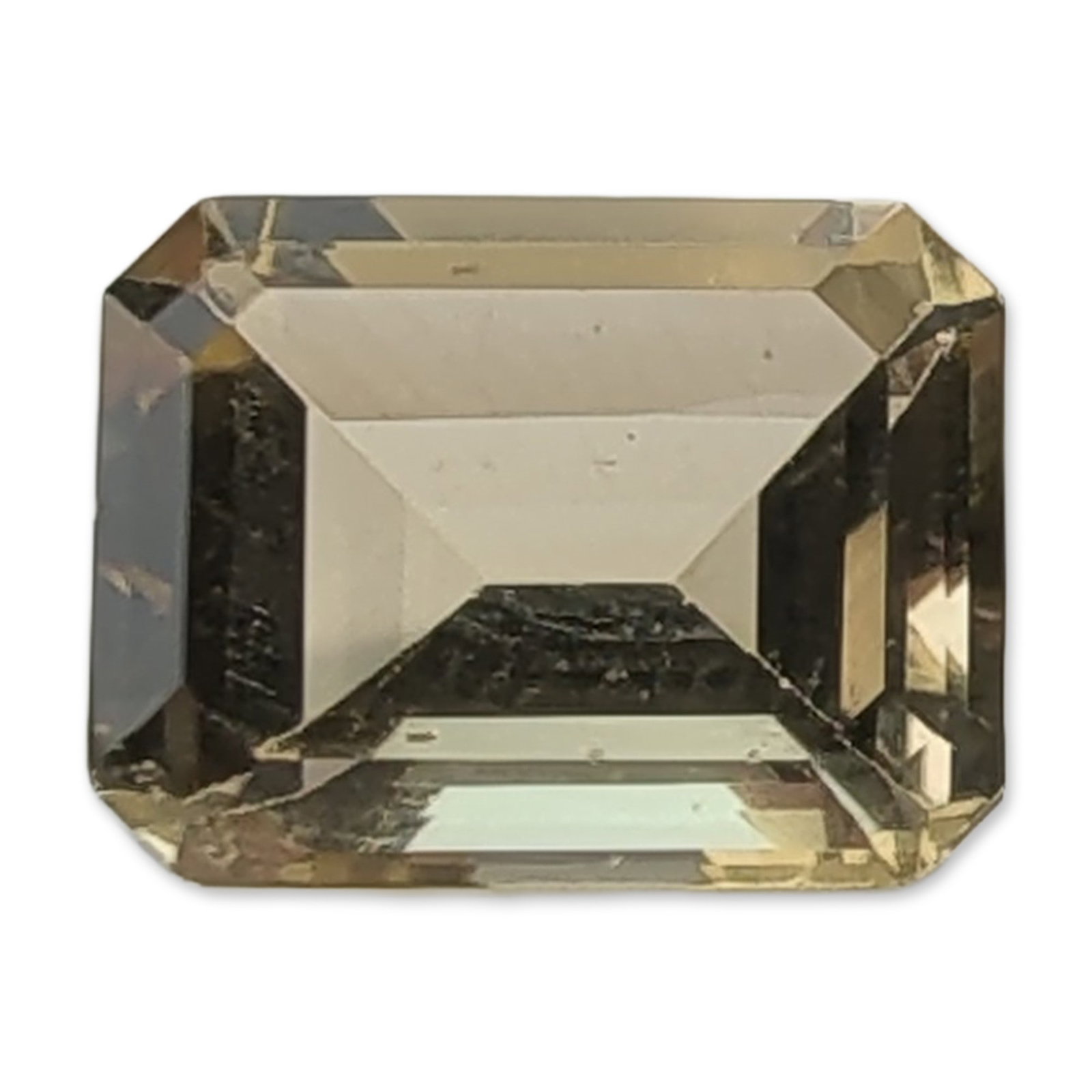 Loose Emerald Cut Citrine: Loose rectangular emerald cut citrine gemstone in a pale yellowish-brown to light olive-green hue. The stone features traditional step-cut faceting and a polished finish. Tested with Presidium Gem Tes