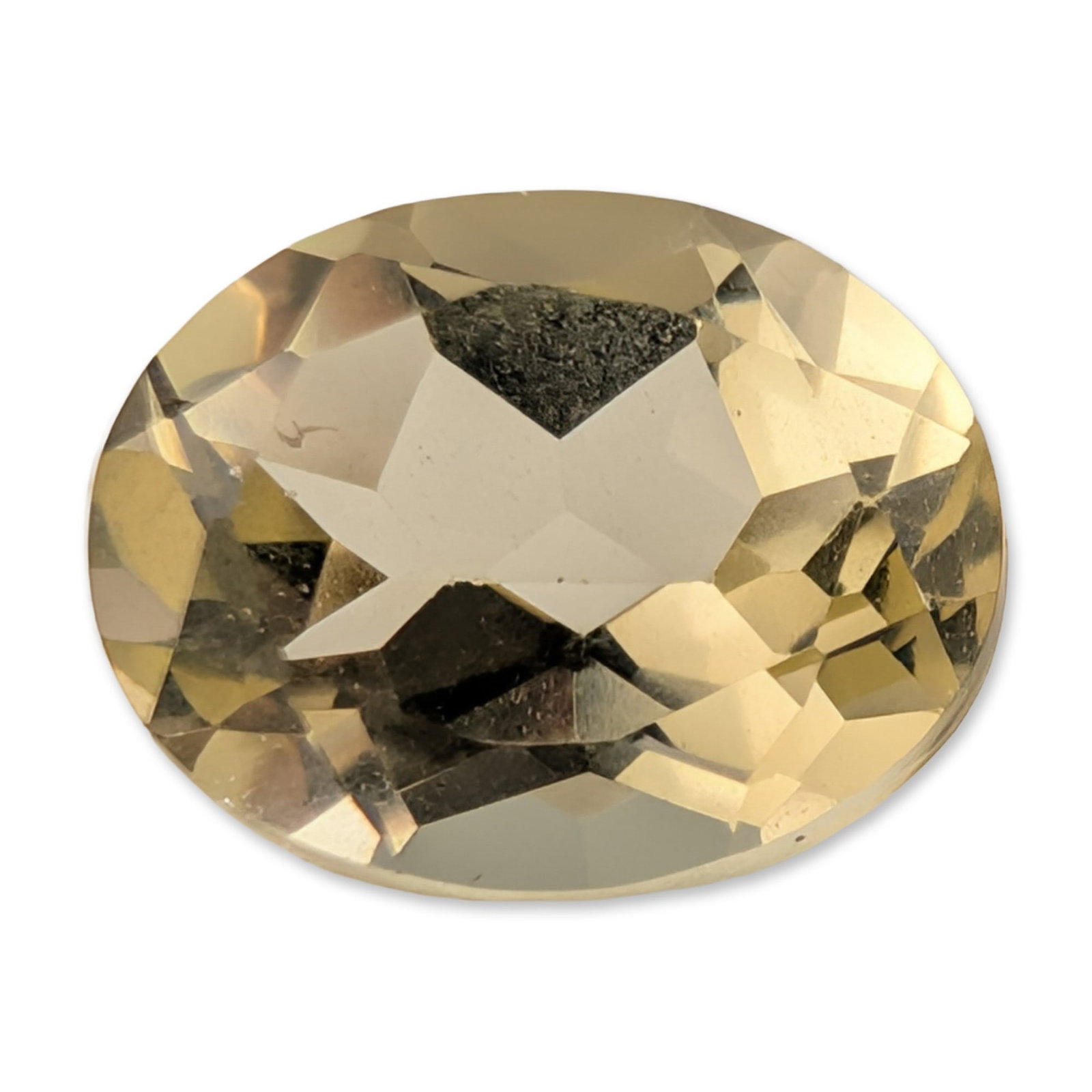 Oval Faceted Pale Yellow Citrine Gemstone: Loose oval faceted citrine gemstone. The stone exhibits a pale yellow or champagne hue with commercial-grade faceting. A prominent, eye-visible dark triangular inclusion is located centrally beneath
