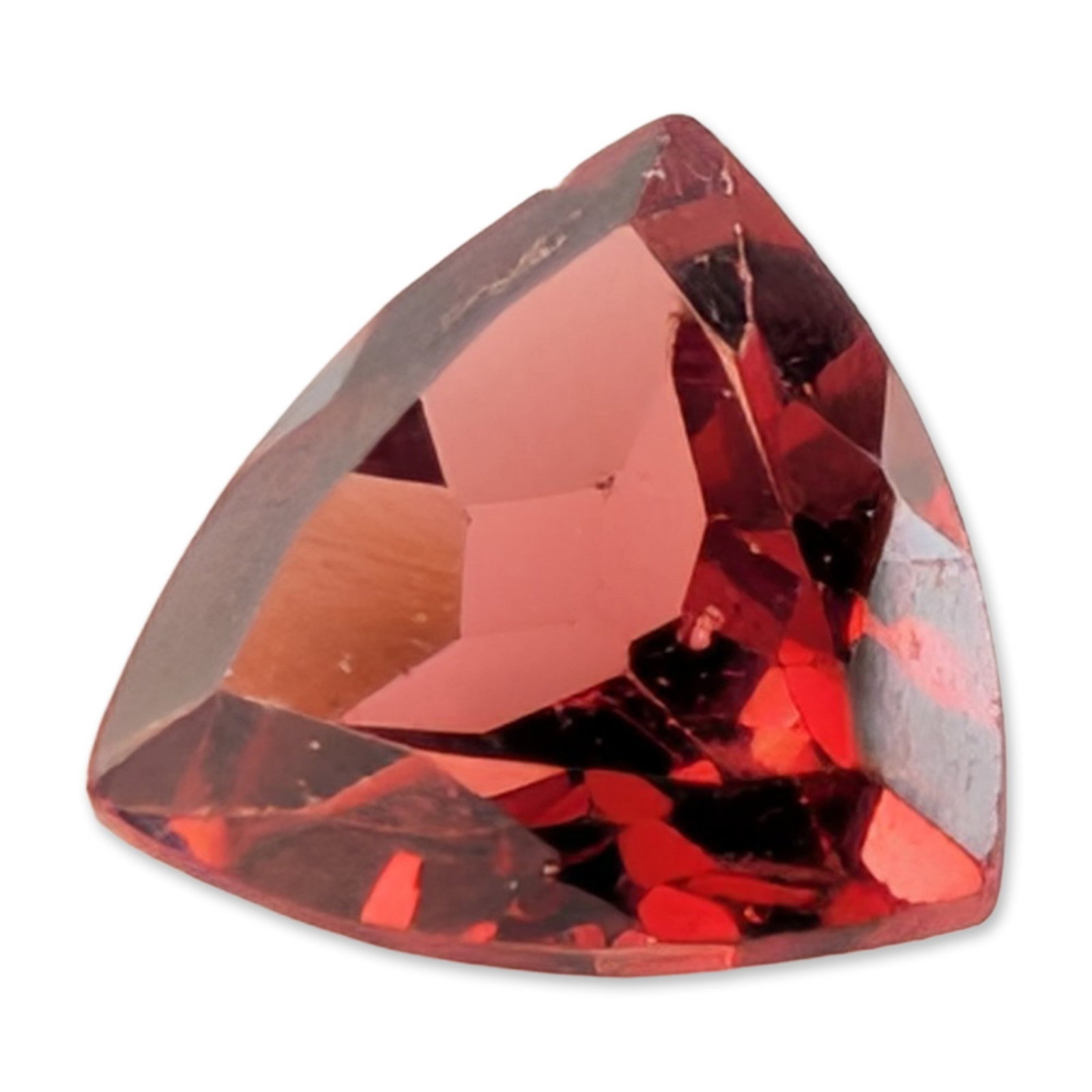 Trilliant Cut Red Garnet Gemstone: Loose faceted gemstone, appears to be a red garnet, featuring a trilliant cut with a faceted crown and pavilion. The stone displays a saturated deep red color and contains minor internal inclusions. T