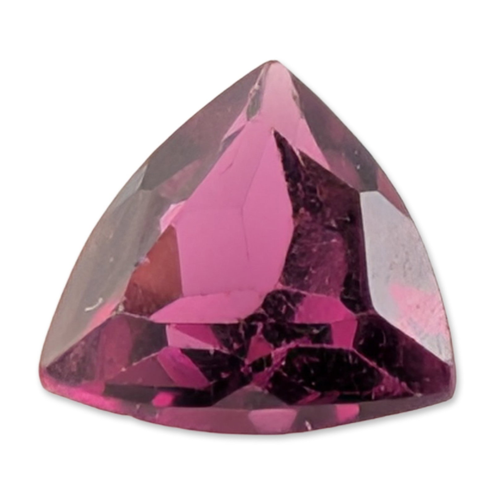 Trillion Cut Rhodolite Garnet Gemstone: A loose gemstone that appears to be a natural rhodolite garnet, featuring an intense raspberry pinkish-purple hue. The stone is fashioned into a faceted modified trillion cut with bowed sides and exhi