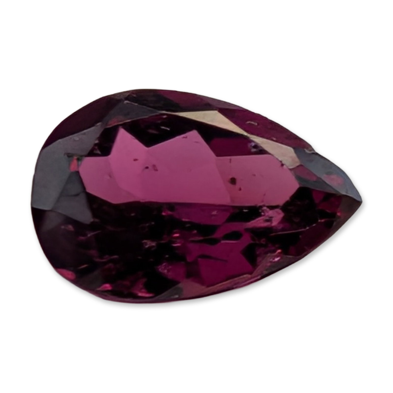 Pear Cut Purplish Red Loose Gemstone: Faceted loose gemstone in a pear-shaped brilliant cut, appearing to be rhodolite garnet or rubellite tourmaline. The stone displays a saturated purplish-red to magenta hue with a teardrop silhouette a