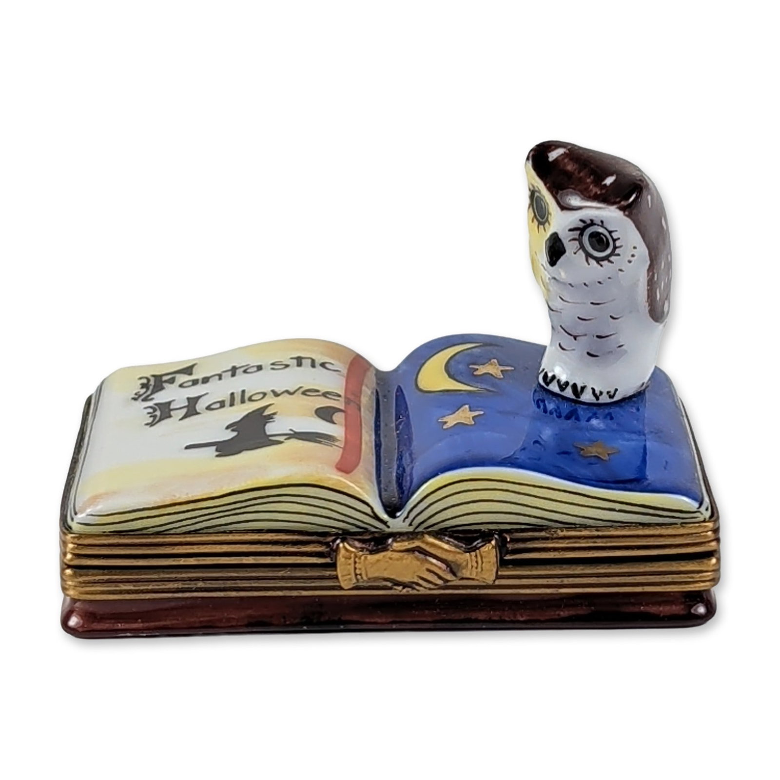 Limoges Halloween Snowy Owl Trinket Box: Hand-painted Limoges porcelain trinket box modeled as an open book with a sculptural snowy owl bust. The owl figure is depicted in a blue wizard-style cape with gold crescent moon and star motifs. The