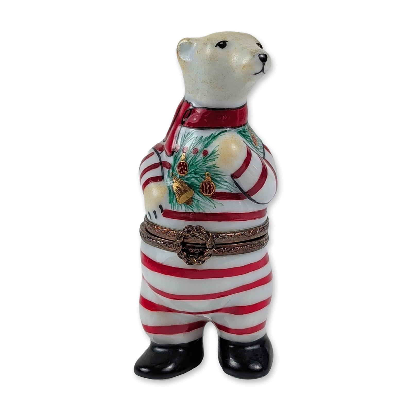 Limoges Porcelain Polar Bear Trinket Box: French Limoges hand-painted porcelain trinket box modeled as a standing polar bear wearing red and white horizontal-striped pajamas featuring festive pine bough and red berry decoration. The bear is f