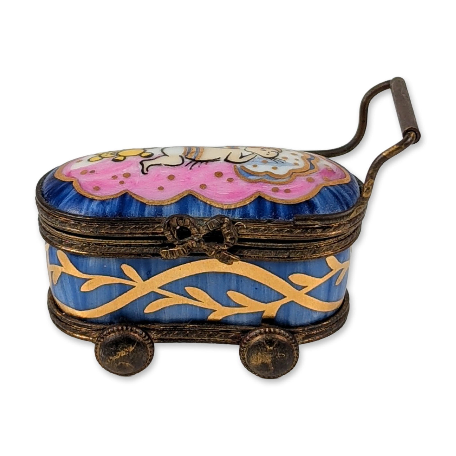 Limoges Porcelain Baby Carriage Box: French hand-painted porcelain Limoges box modeled in the form of a baby carriage. The piece features a cobalt blue ground with gilt foliate scrolls and a central lid vignette depicting a sleeping