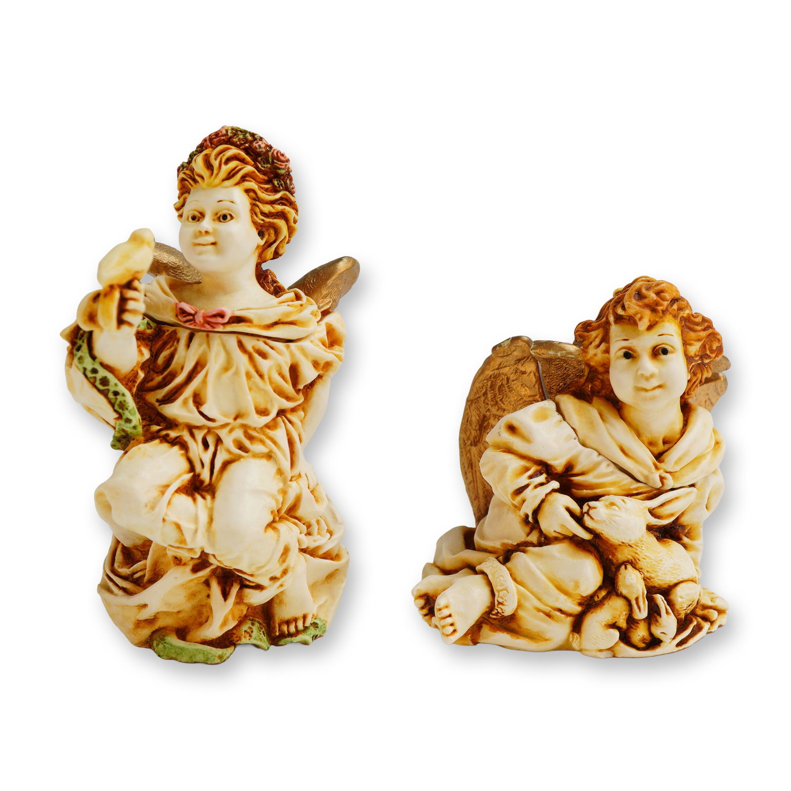 2pc Harmony Kingdom Trinket Boxes, Joie De Vivre and La Gardienne: The box titled La Gardienne (ANSE98) , depicts a winged cherub with a floral crown holding a small bird. The figurine titled Joie De Vivre (ANJO) , depicts a winged cherub holding a rabbit. Both items
