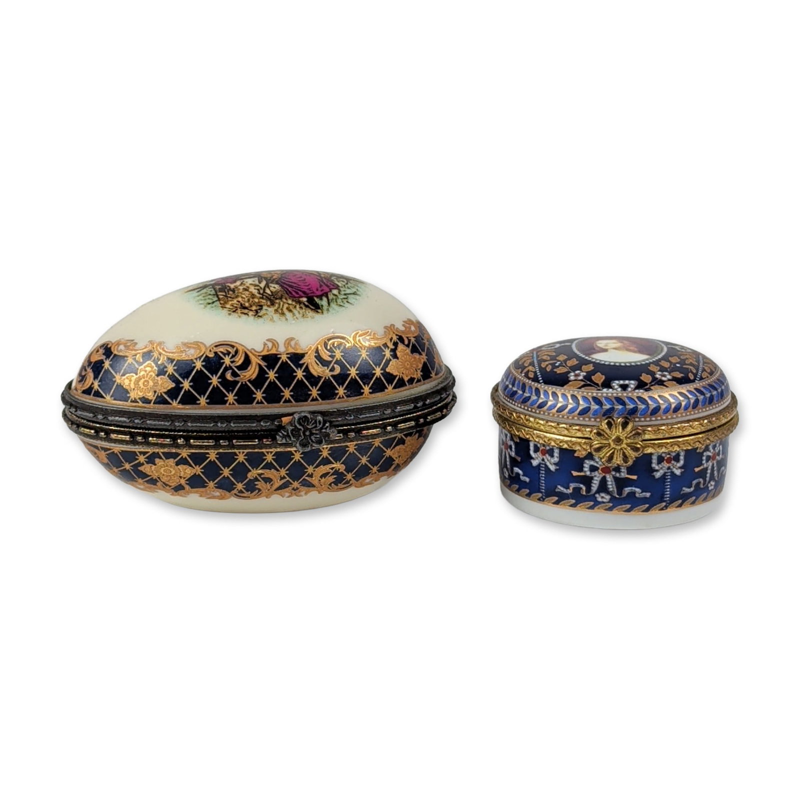2pc Gilt Porcelain Portrait and Courting Couple Jewelry Boxes: This collection includes a circular porcelain box featuring a transfer-printed portrait of a woman in a red hat on a cobalt blue ground, accented by gilt laurel wreaths and raised white enamel jewelin