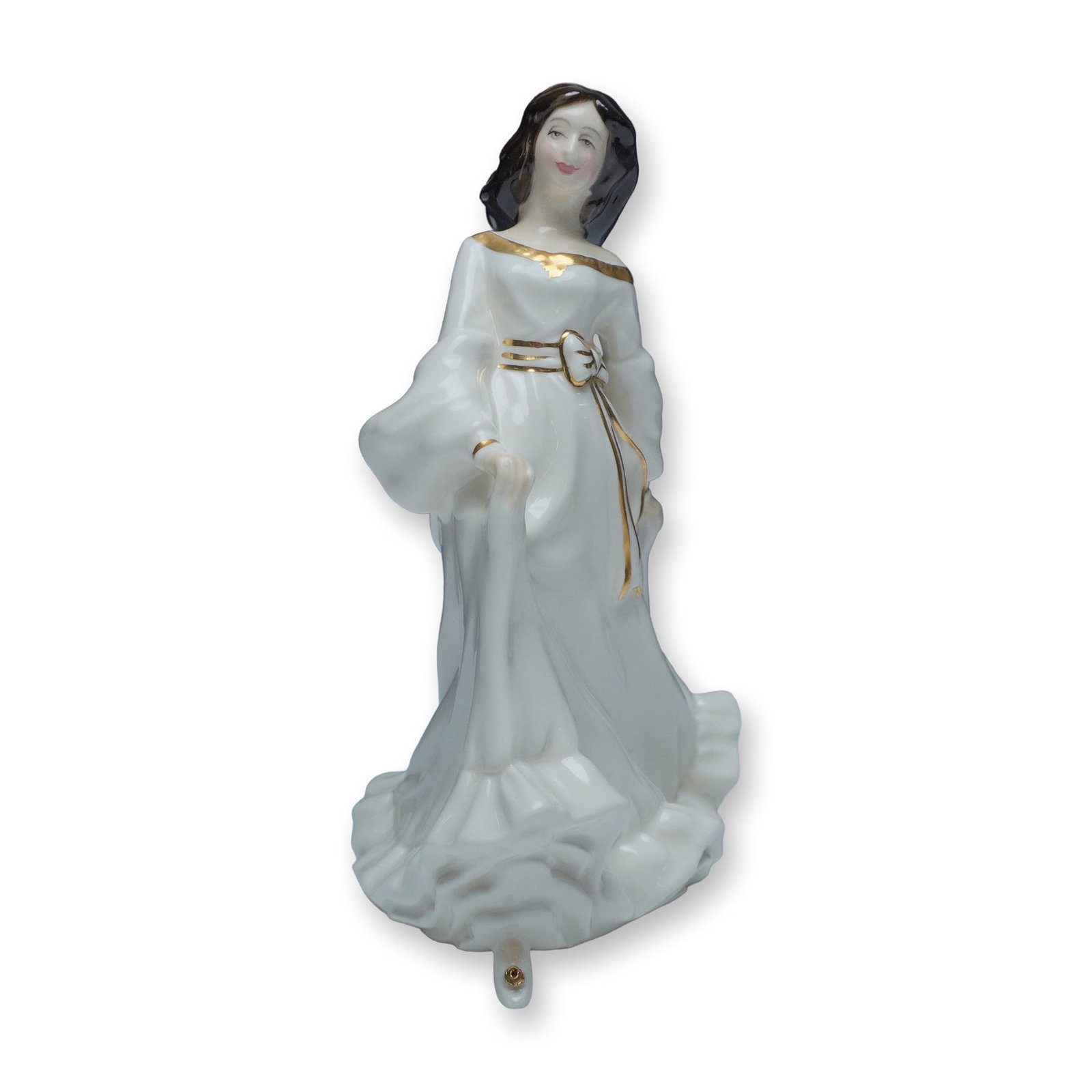 Royal Doulton Figurine, Free Spirit HN3728: This Royal Doulton figurine, titled "Free Spirit" (HN3728), depicts a graceful woman in flowing white attire with gold accents and a soft, serene expression. Sculpted by artist Margaret Tarrant, this 
