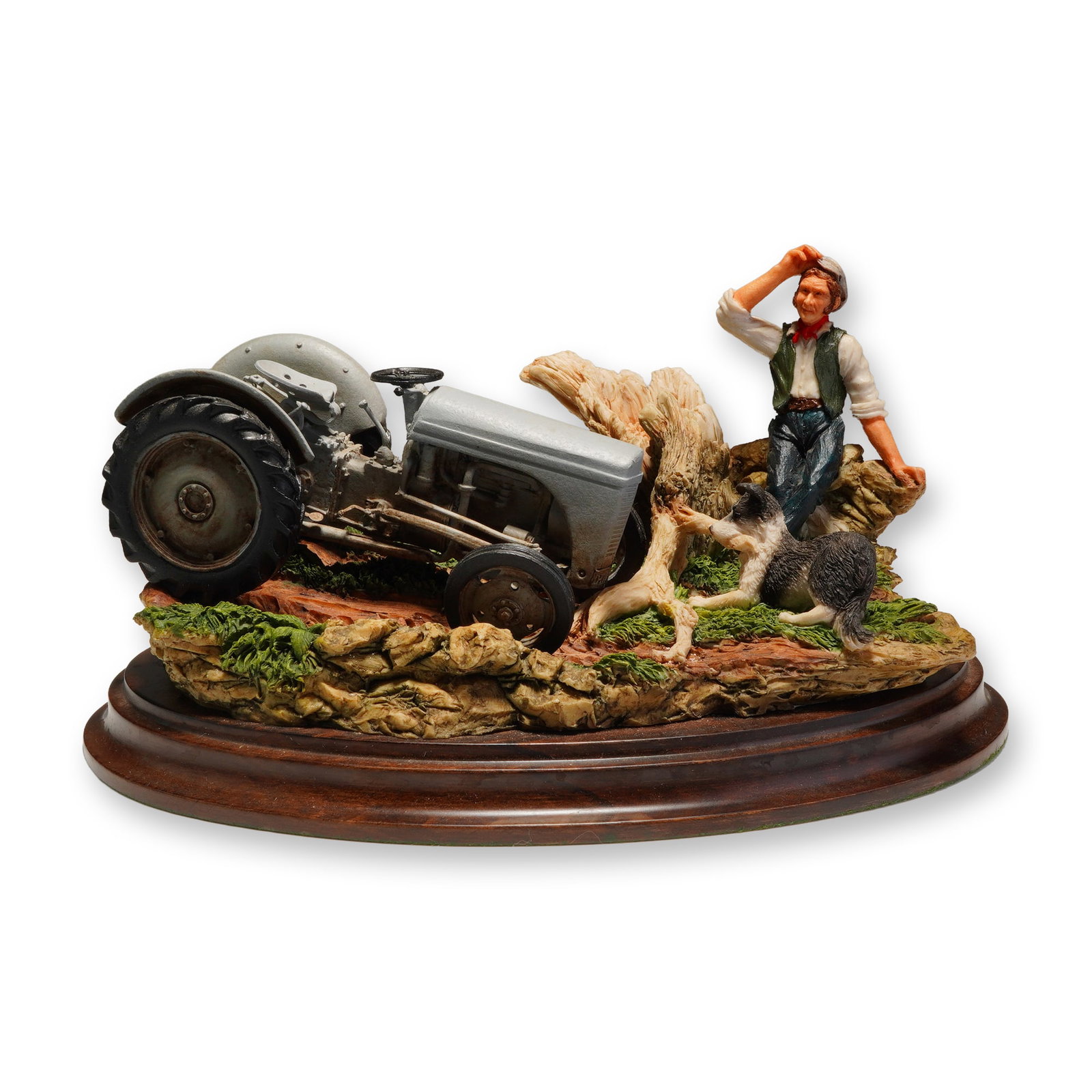 Country Artists Resin Figurine Helping Hand: A Country Artists resin tableau CA 731 titled Helping Hand, depicting a hand-painted scene of a man, a border collie, and a grey tractor on a rocky base affixed to wooden base, inscribed 1994.