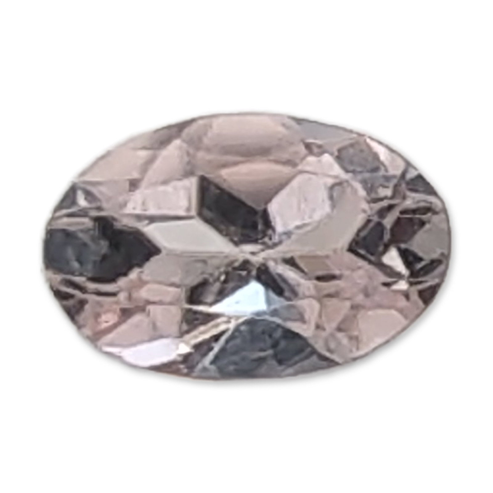 Loose Pale Pink Oval Faceted Tourmaline Gemstone: A loose faceted tourmaline gemstone in a pale pinkish-lavender hue. The stone is worked in an oval mixed cut with a transparent body and visible internal reflections. 0.4ct Dimensions: 5.9W MM