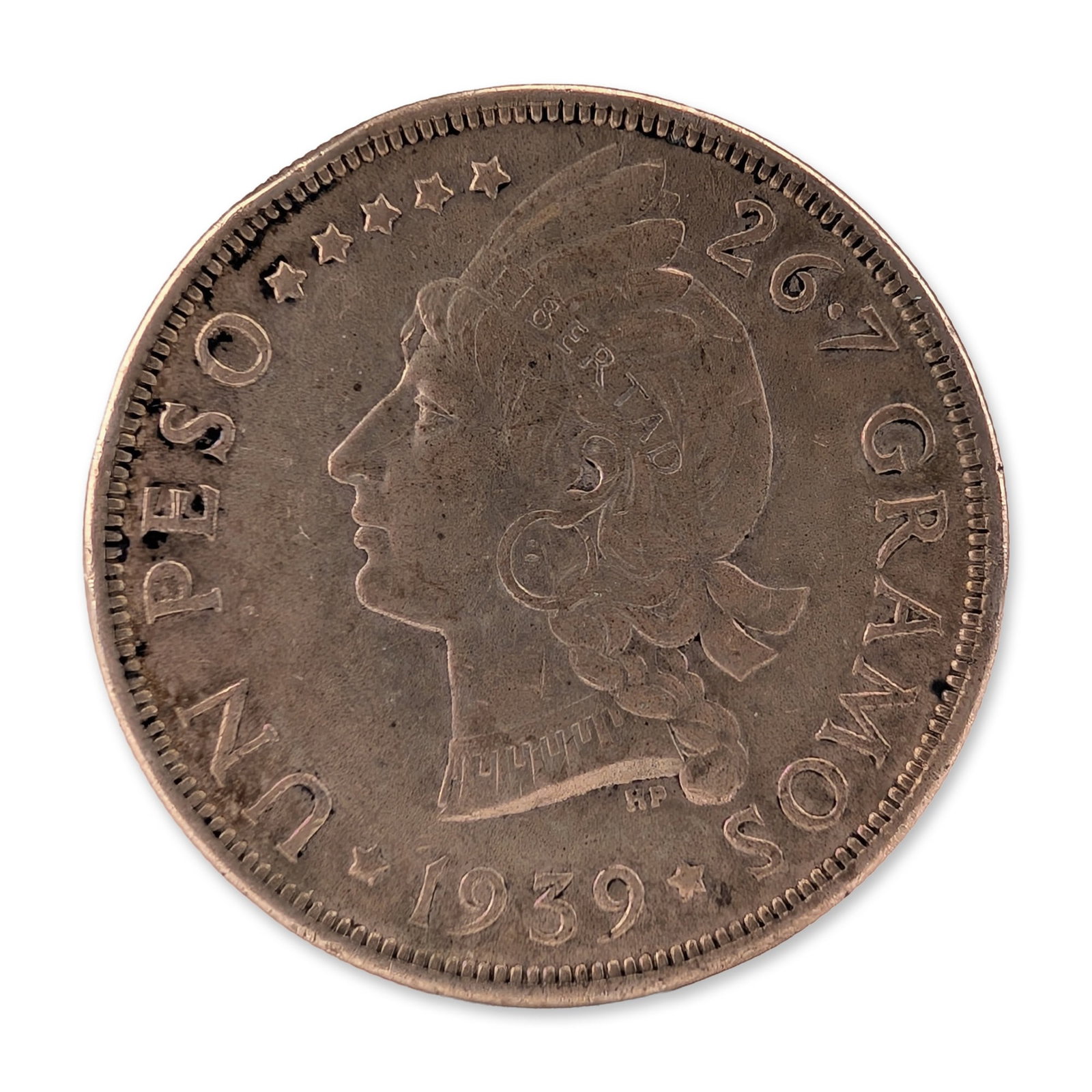 1939 Dominican Republic Silver 1 Peso Coin: Dominican Republic 1939 silver 1 Peso coin, struck in .900 fine silver. The obverse features a profile portrait of Liberty facing left, wearing a Phrygian cap inscribed LIBERTAD, surrounded by five st