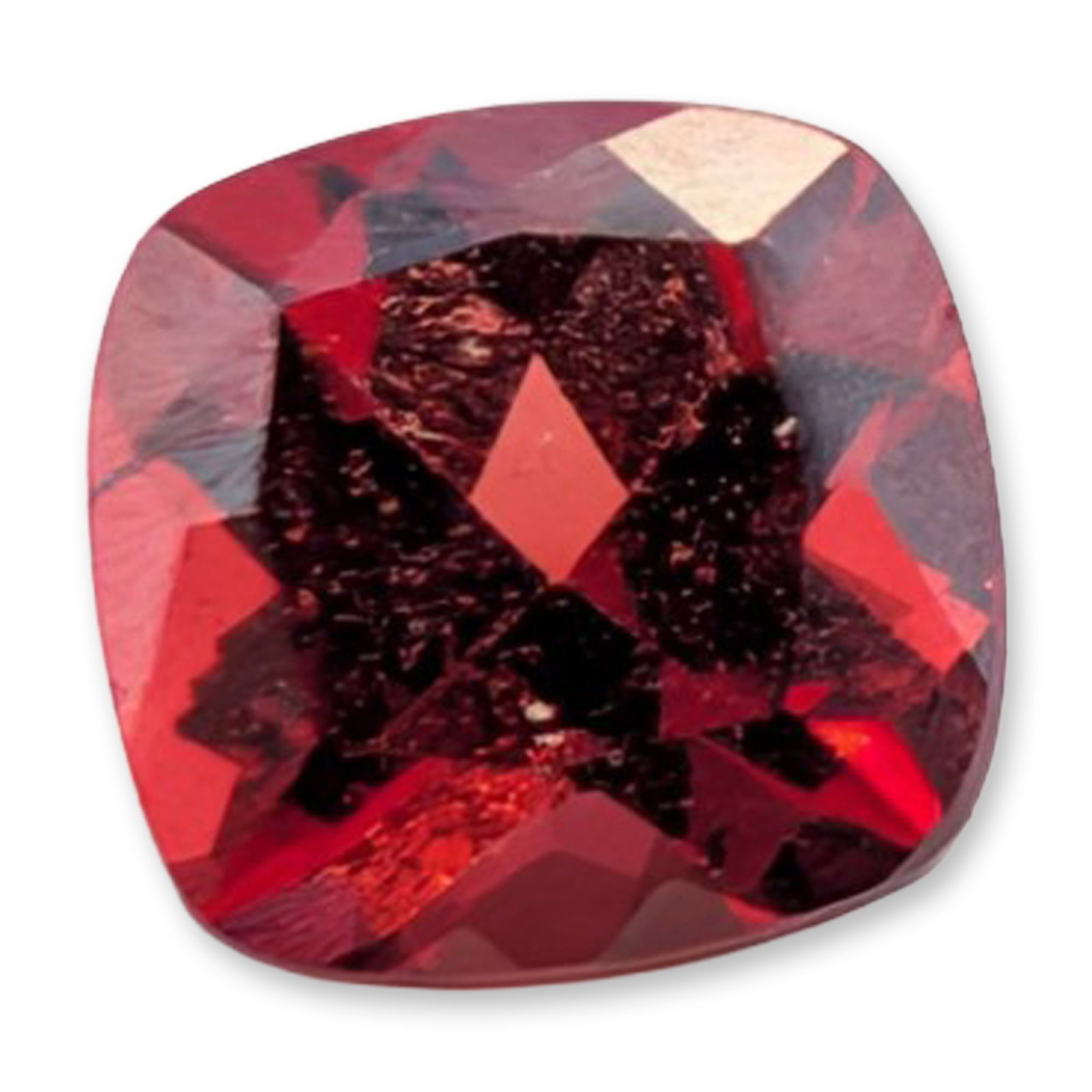 Cushion Cut Red Garnet Gemstone 1.2 Carats: Loose red gemstone, which appears to be a red garnet, featuring a saturated deep red color with internal flashes. The stone is fashioned in a cushion cut with a medium crown and pavilion. Visual inspe