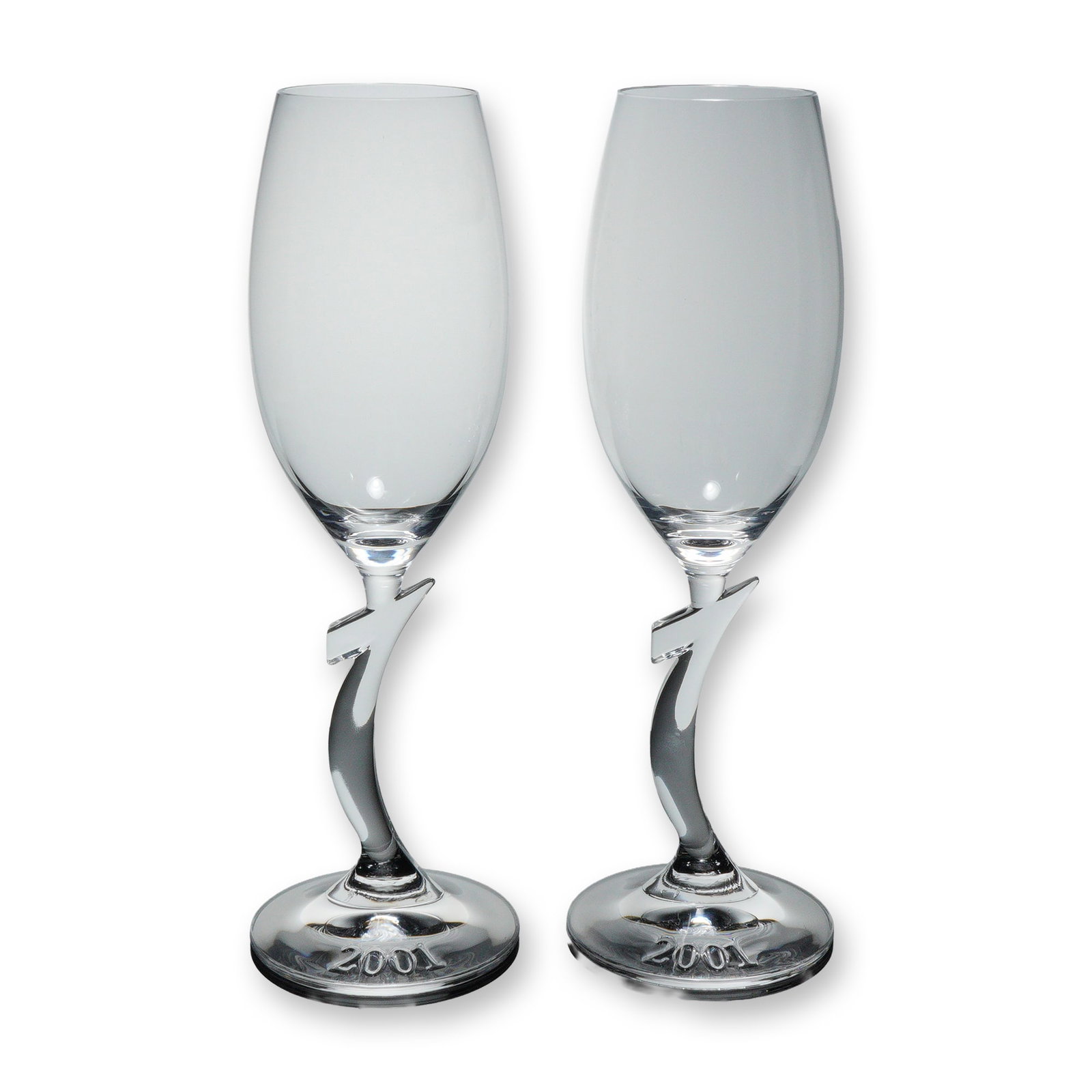 2pc Riedel Crystal Champagne Glasses, Millenium: A pair of Riedel crystal champagne glasses featuring a distinctive sculpted stem with a 1 form and the year 2001 etched to the foot, each signed Riedel, crafted in clear crystal Dimensions: Each