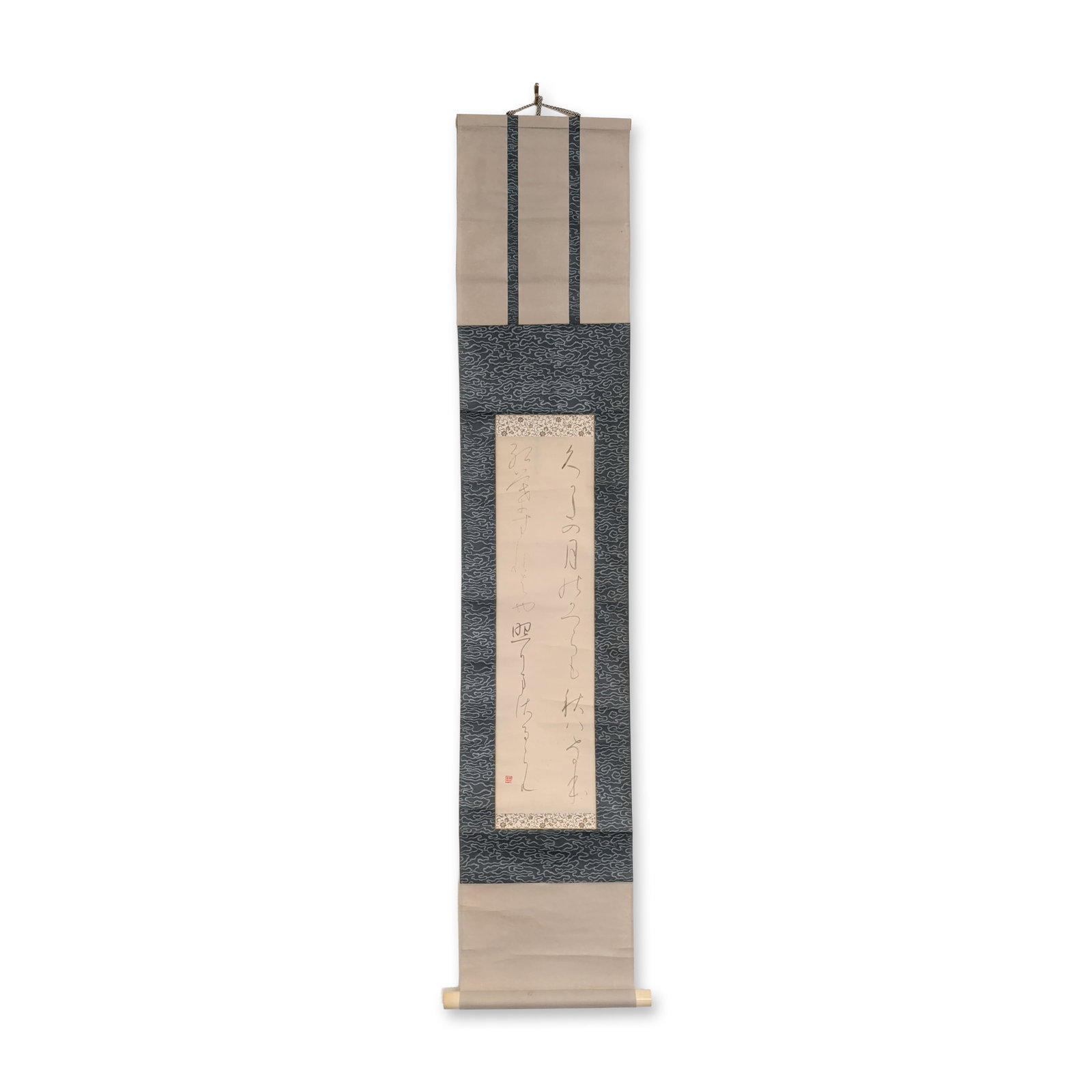 Japanese Calligraphy Ink on Paper Hanging Scroll: Japanese hanging scroll, or kakejiku, featuring calligraphy in ink on paper. The central text is executed in a fluid cursive grass script, or sosho, likely representing a poem or Buddhist verse. The w