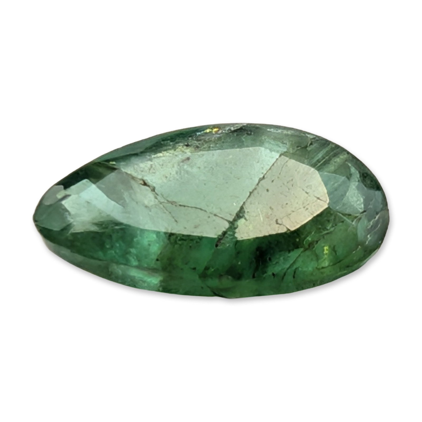 Natural Green Emerald Pear Cut Gemstone: A loose faceted gemstone, appears to be a natural emerald, featuring a medium-dark green color and pear-shaped cut. The stone exhibits significant internal inclusions, or jardin, including veining