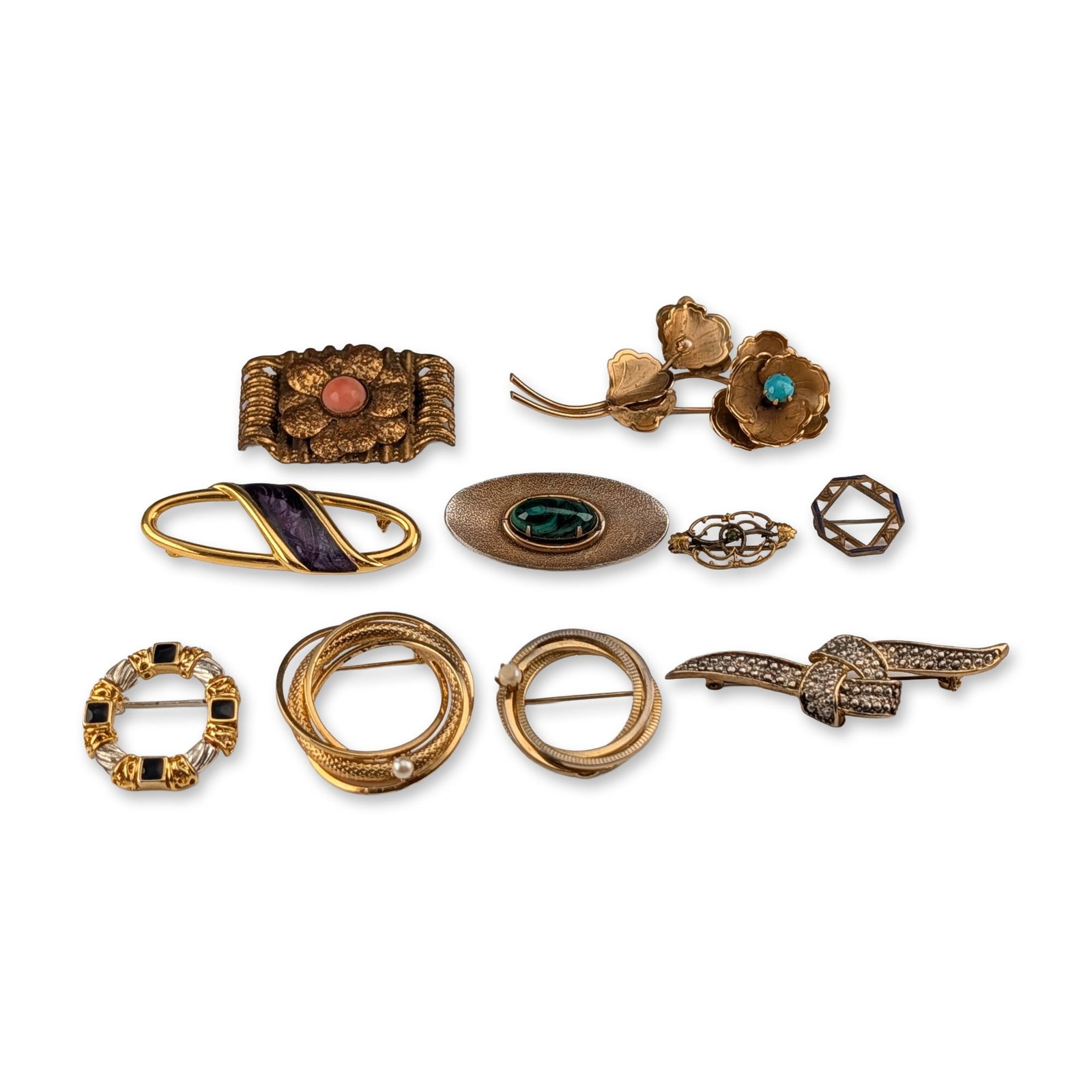 10pc Assortment of Vintage Costume Jewelry Brooches: Vintage assortment of ten costume jewelry brooches in various gold-tone and silver-tone metals. The collection features a variety of motifs including floral sprays, geometric forms, and abstract hoops