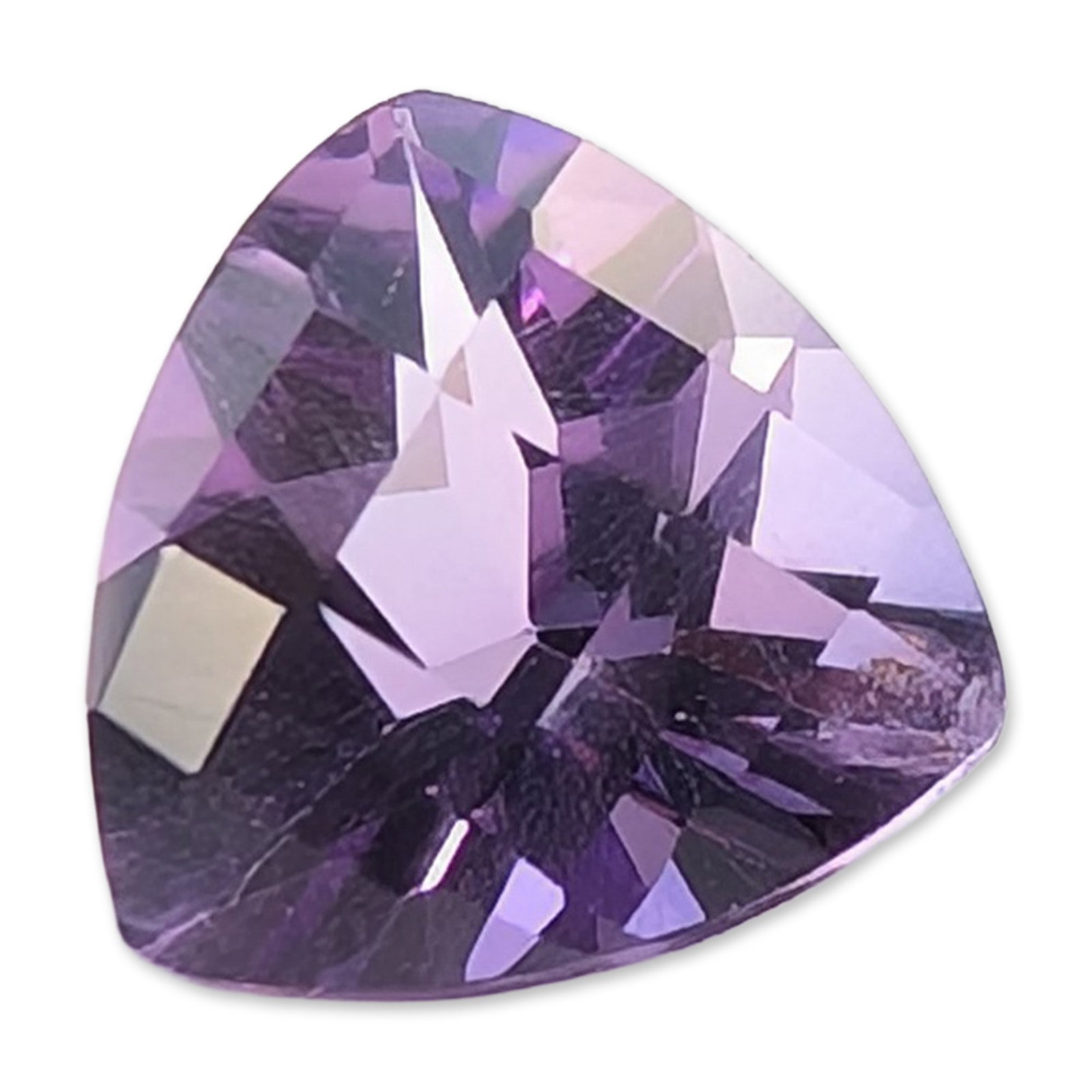 Trillion Cut Purple Amethyst Loose Gemstone: A loose amethyst gemstone, fashioned into a trillion cut with slightly bowed sides. The stone displays a saturated purple hue with lighter lavender flashes and even color distribution. It features a