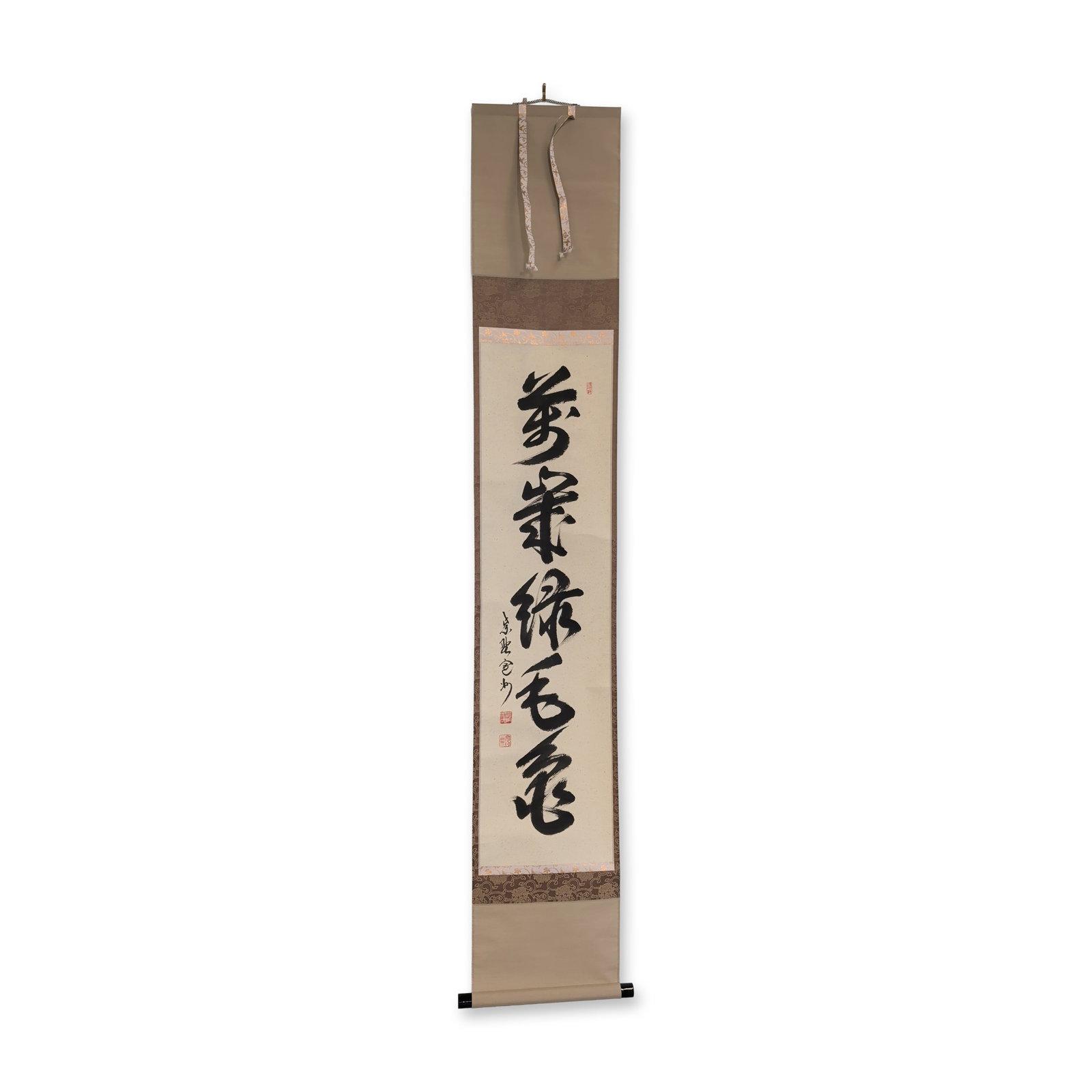 Japanese Ink on Paper Zen Calligraphy Hanging Scroll: Japanese hanging scroll in Ink on paper that features a zen style calligraphy work in bold cursive grass script representing an auspicious phrase. The work is professionally mounted on a brown and