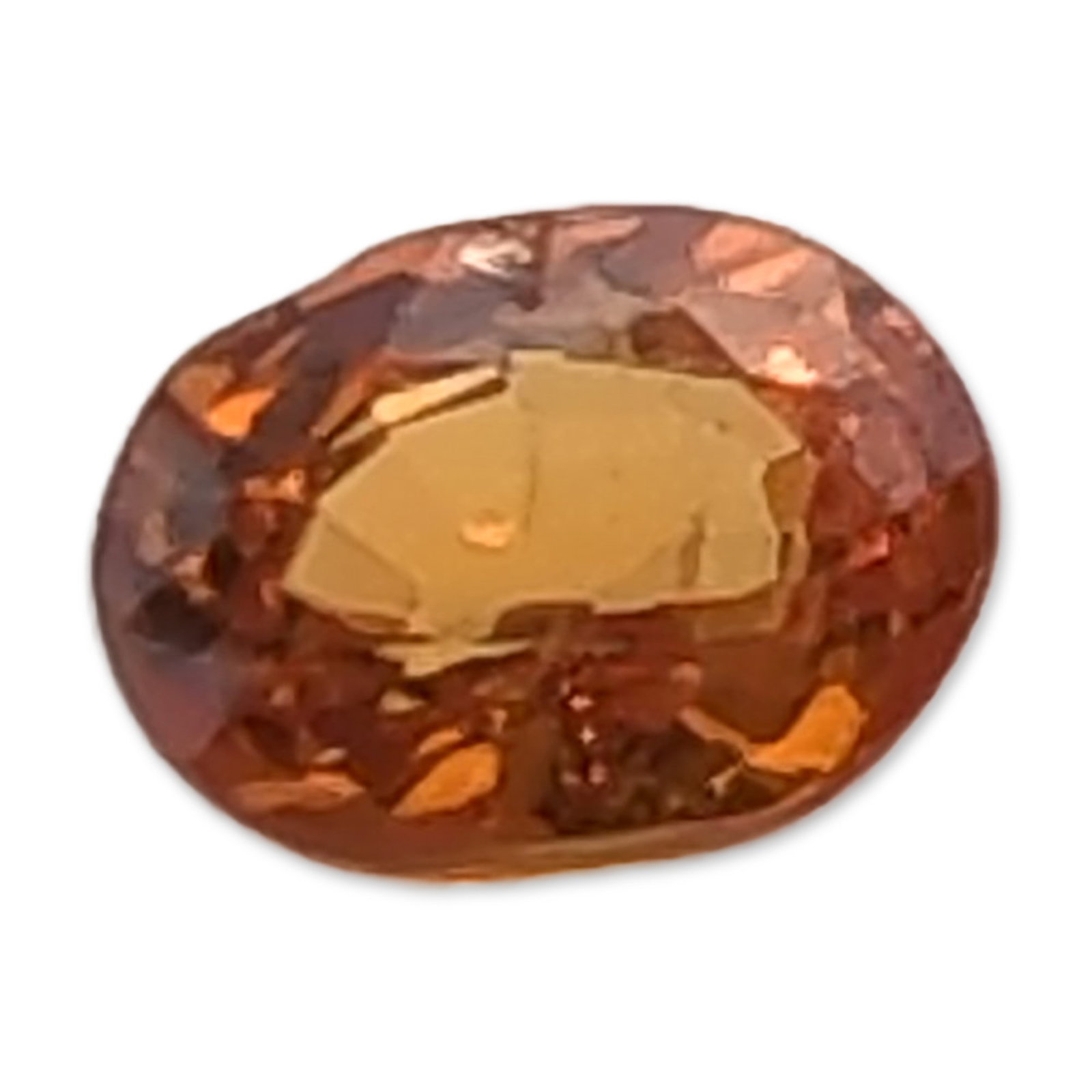 Loose Oval Faceted Orange Gemstone: Loose faceted gemstone exhibiting a deep yellowish-orange color with subtle brownish undertones. Faceted in an oval cut. 0.4 carats 4.9 mm length. Dimensions: 4.9mm