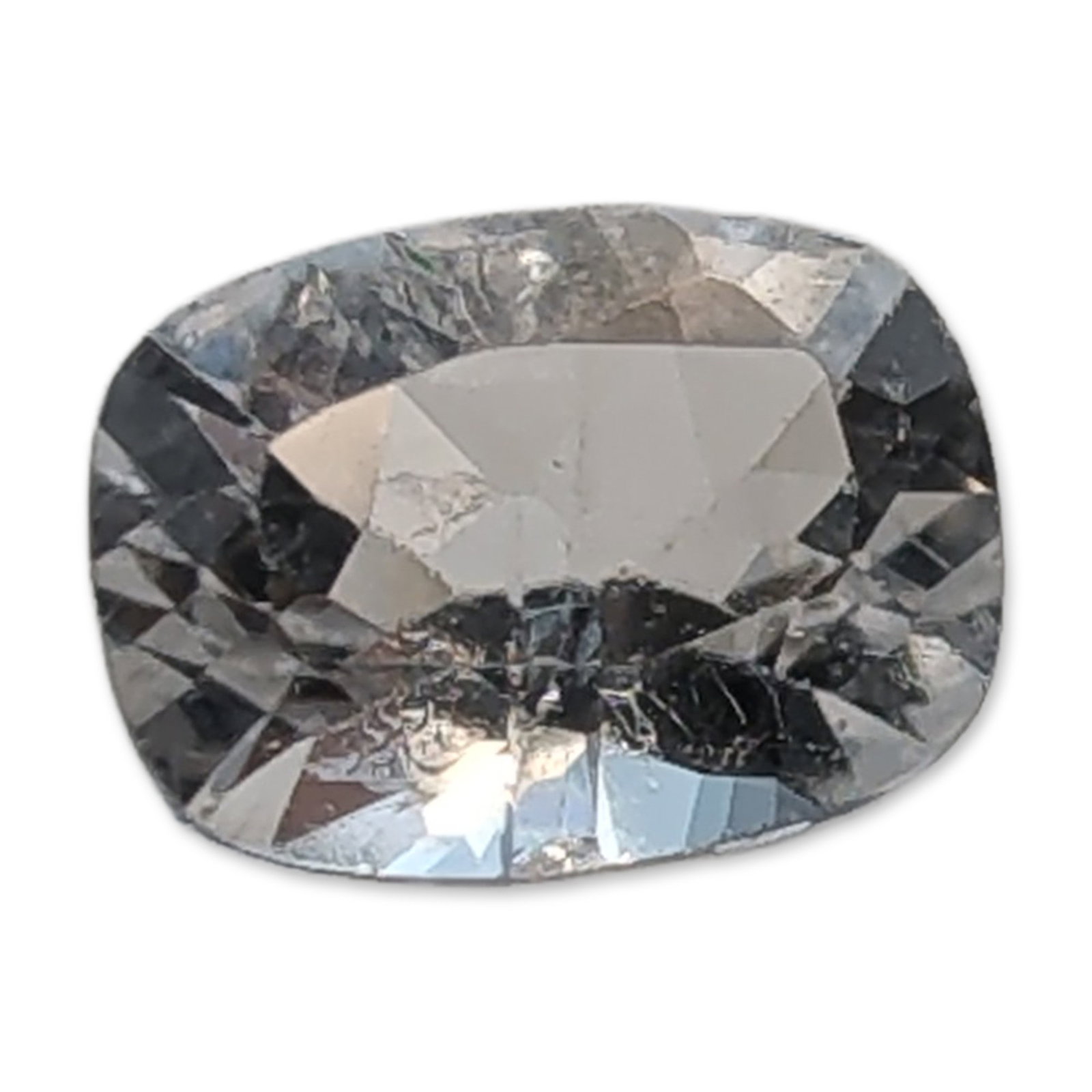 Loose Cushion Cut White Sapphire: Loose white sapphire gemstone. Specimen features a cushion cut and is transparent. A prominent linear inclusion is visible through the table facet. Tested with Presidium Gem Tester II. Measurements: