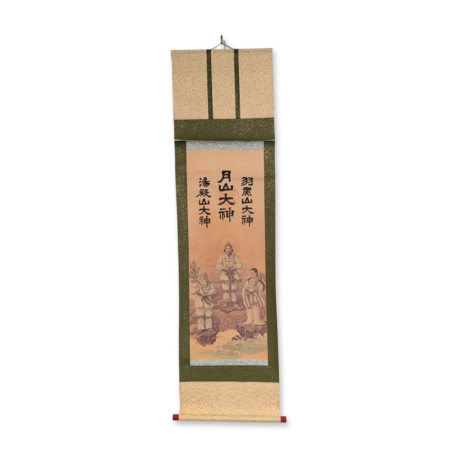 Japanese Dewa Sanzan Deities Hanging Scroll: Japanese hanging scroll depicting the deities of the Dewa Sanzan mountains. Executed in offset lithograph and ink on paper, the work includes three columns of calligraphy identifying three deities. A 