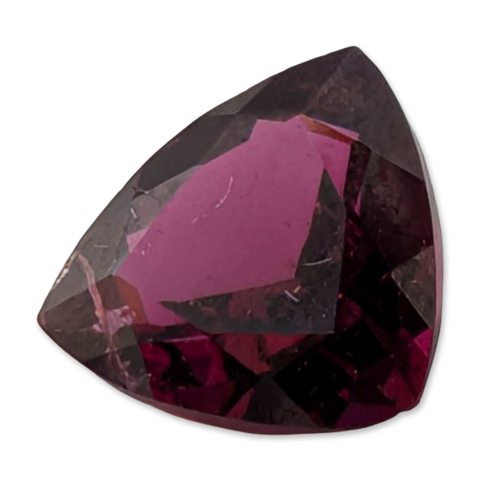 Trillion Cut Rubellite Tourmaline Loose Gemstone: Loose faceted gemstone that appears to be a rubellite tourmaline featuring a saturated magenta to reddish-purple hue and a triangular trillion cut. The stone exhibits visible internal characteristics.
