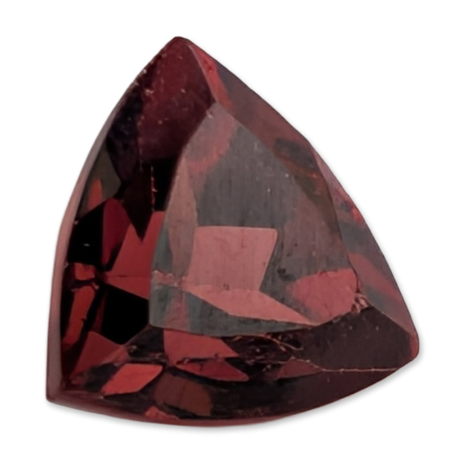 Trillion Cut Red Garnet: A loose faceted gemstone that appears to be a red garnet, featuring a deep brownish-red color and saturated tone. The stone is fashioned in a trillion cut with uniform coloration and internal reflecti