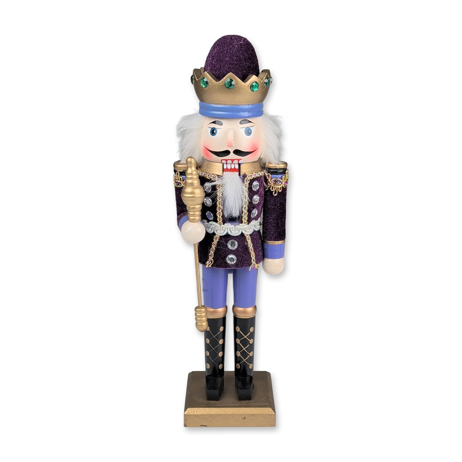 Royal King Wooden Nutcracker: Decorative wooden nutcracker in the form of a royal king. Constructed from painted wood, the figure is dressed in a purple velvet tunic accented with gold metallic braid and silver-tone faux-jeweled b
