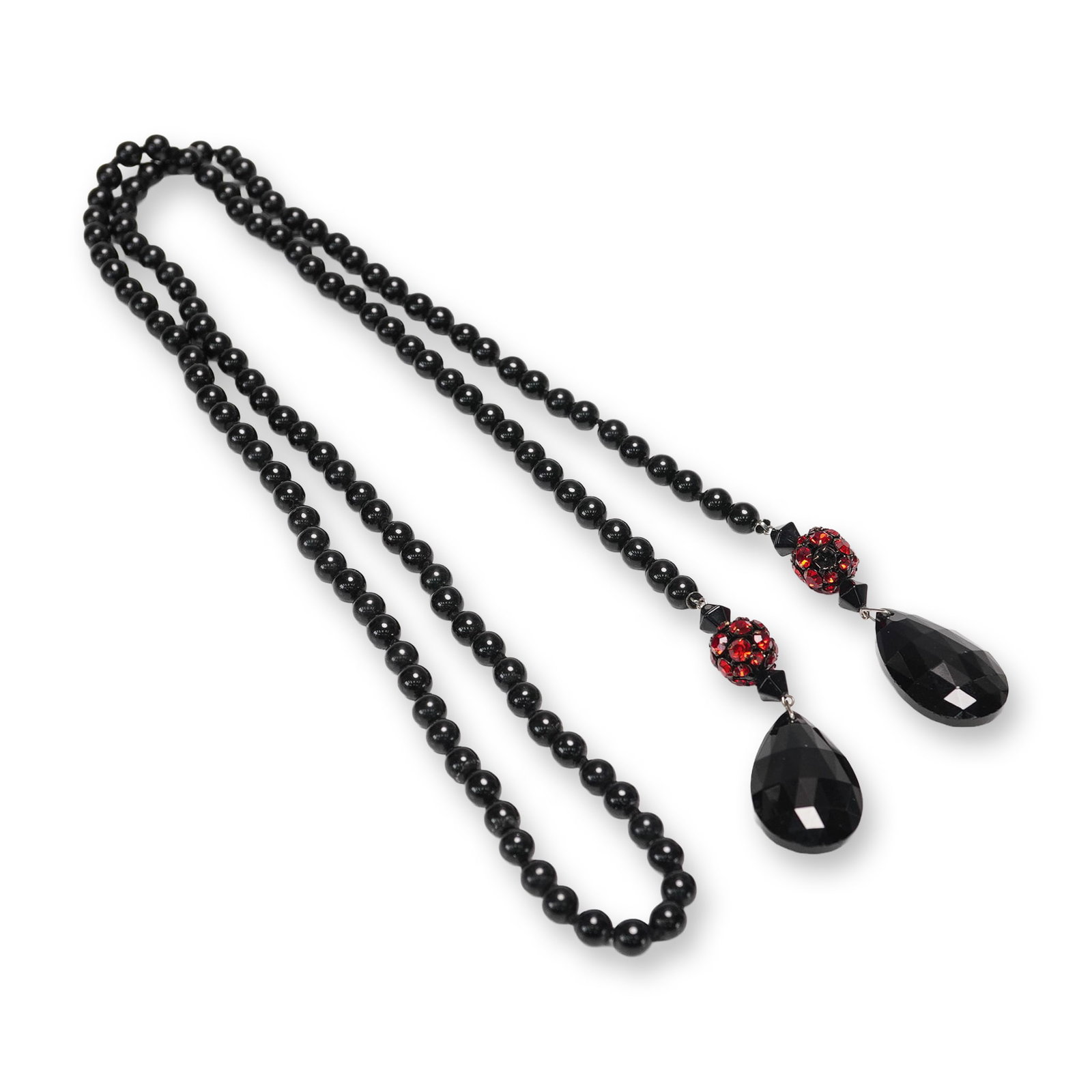 Black and Red Beaded Necklace: Black beaded necklace featuring round obsidian-colored beads arranged in a uniform strand. The focal point of the necklace includes two faceted teardrop pendants made from black acrylic, each