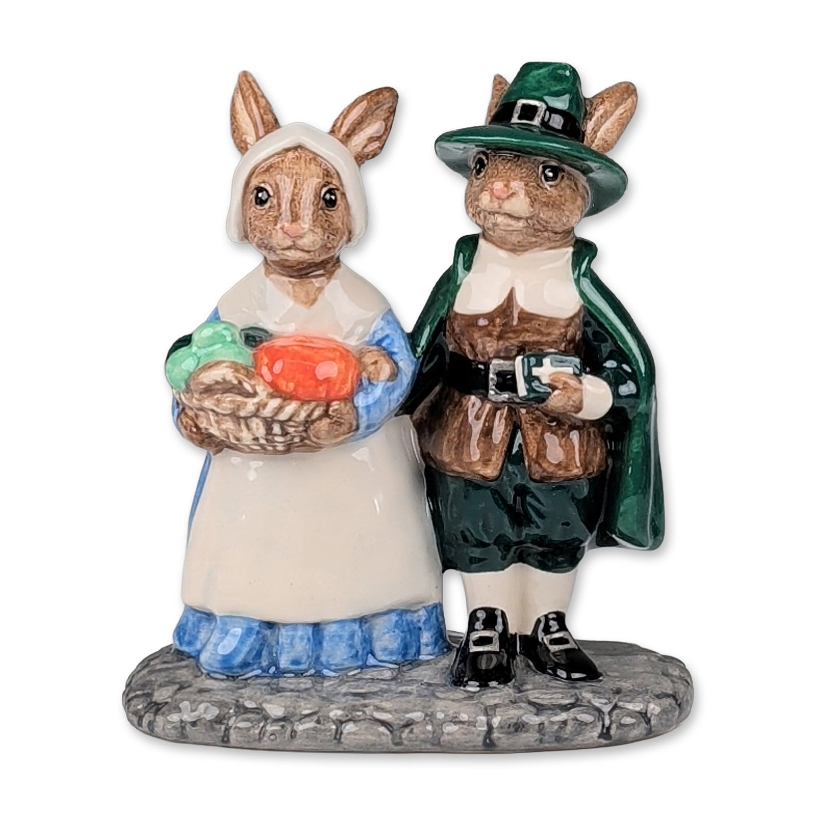 Royal Doulton Bunnykins Figurine, Pilgrim DB212: Limited edition 1836 of 2500, depicting two anthropomorphic rabbits in colonial American attire. The male figure is dressed in a green coat and buckled hat holding a book, and the female figure wears 