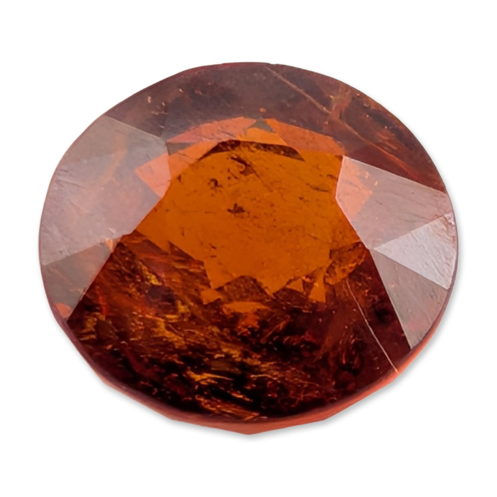 Round Cut Orange Garnet Gemstone: Loose faceted gemstone, appears to be a spessartine or hessonite garnet, featuring a vibrant reddish-orange hue with brownish undertones. The stone is fashioned in a round brilliant cut and exhibits p