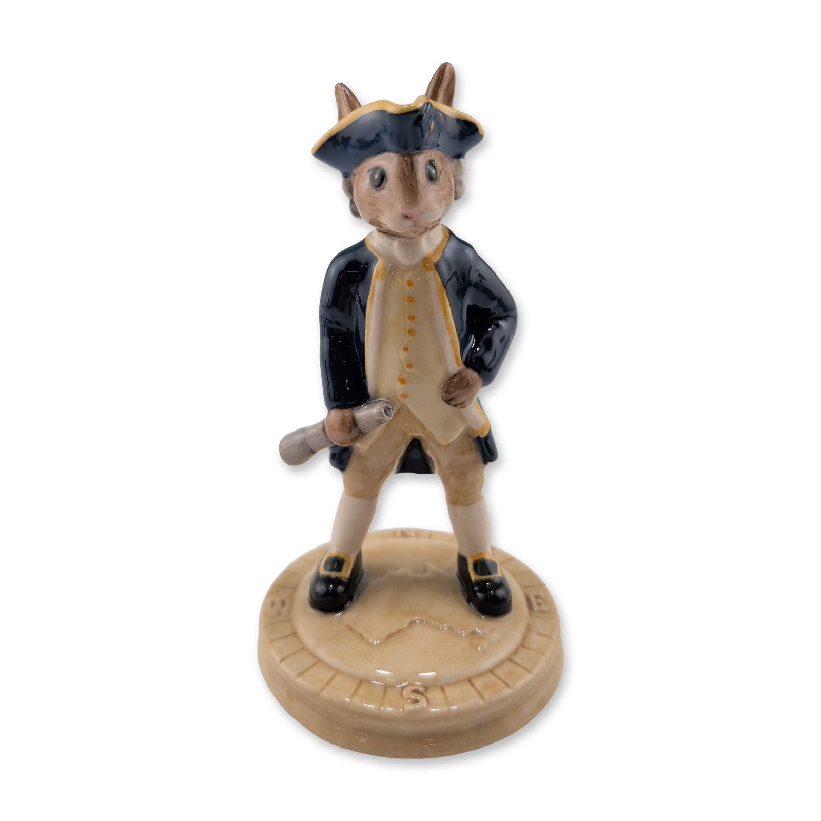 Royal Doulton Captain Cook Bunnykins Porcelain Figurine: Royal Doulton hand-decorated porcelain figurine titled Captain Cook, model DB 251, from the Bunnykins collection. The piece depicts an anthropomorphic rabbit as the 18th-century explorer, dressed in a
