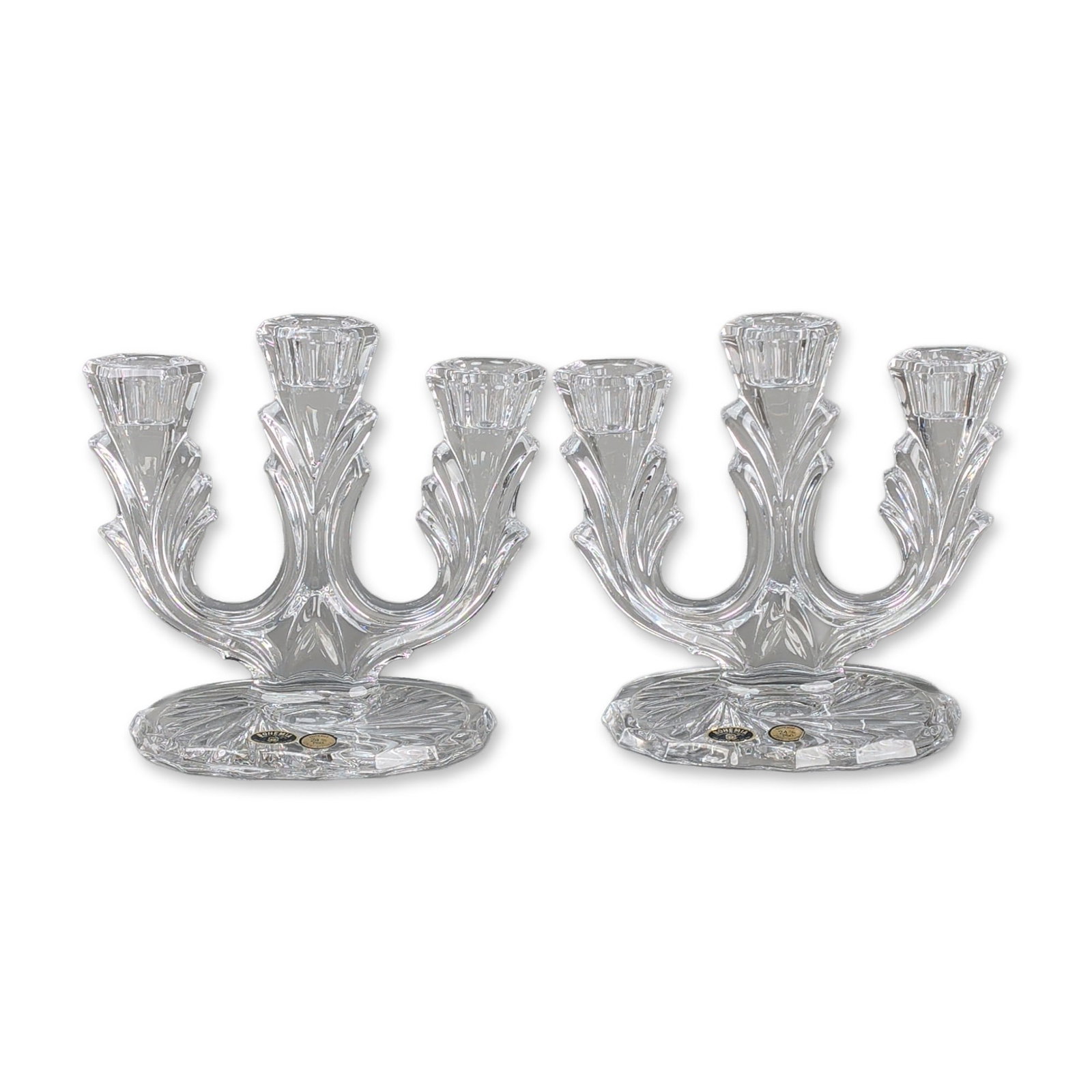 Pair of Bohemia Czech Lead Crystal Candelabras: Bohemia, Czech Republic. Pair of three-light candelabras in 24% lead crystal, featuring molded foliate stems and arms terminating in fluted candle cups. The circular bases are decorated with a radial 