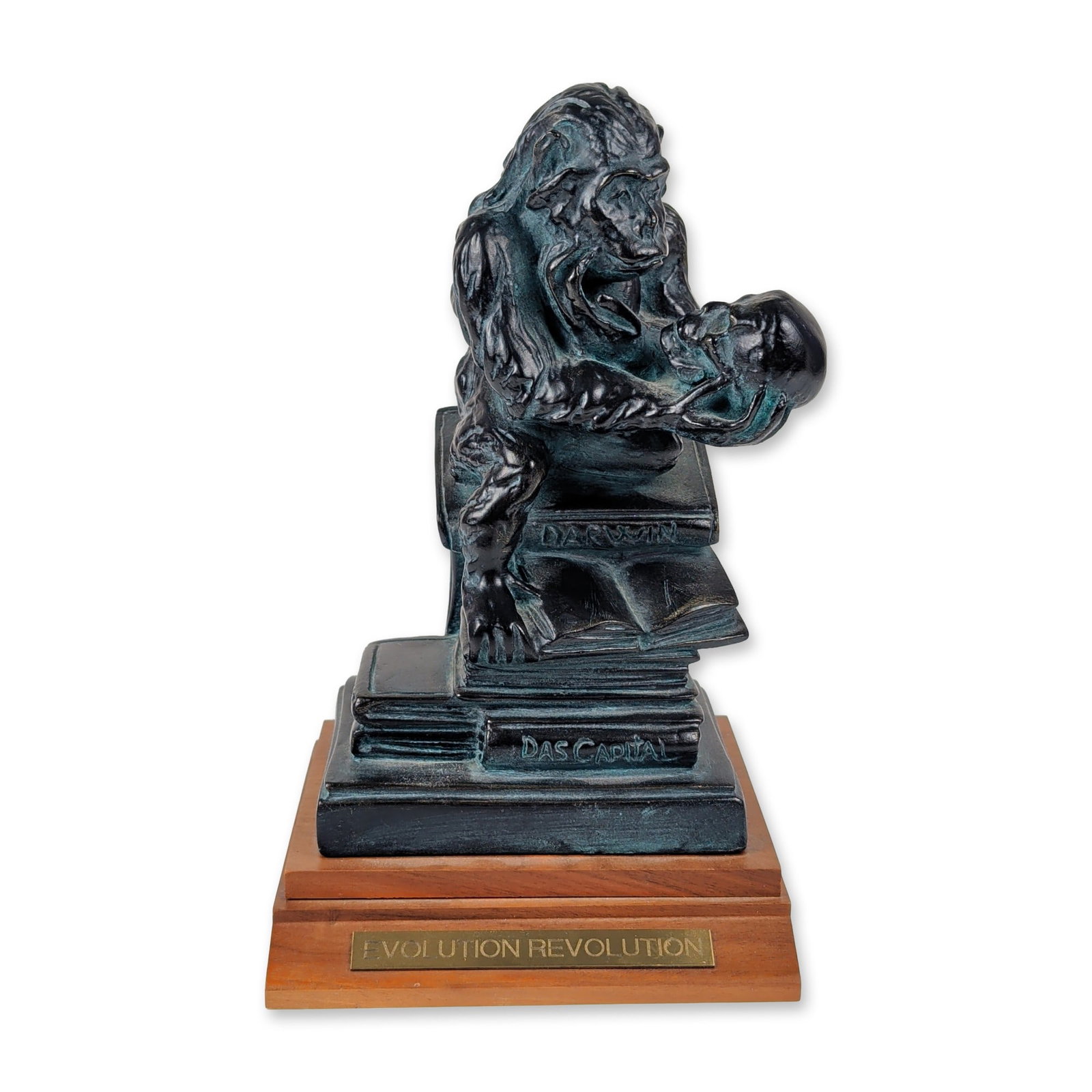 After Wolfgang Hugo Rheinhold Evolution Revolution Sculpture: Figural sculpture after Wolfgang Hugo Rheinhold, based on the late 19th-century work Affe mit Schadel (Ape with Skull). This contemporary adaptation is cast in resin with a dark bronze patina and verd