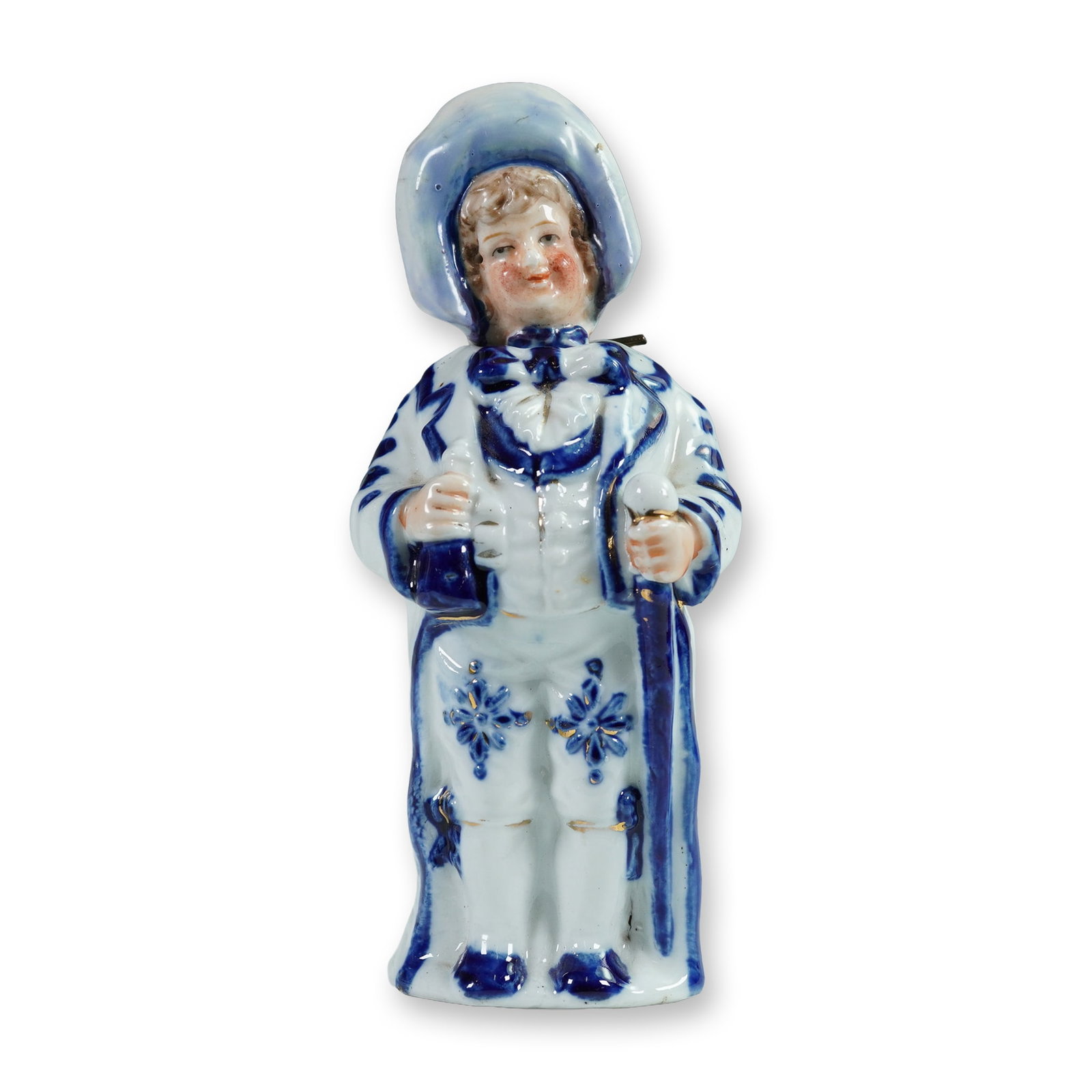 Continental Figural Nodder, Gentleman: A Continental hand-painted glazed porcelain figural nodder depicting a cheerful gentleman dressed in formal attire. The figure is adorned with cobalt blue and gilt detailing over a white glaze, with f