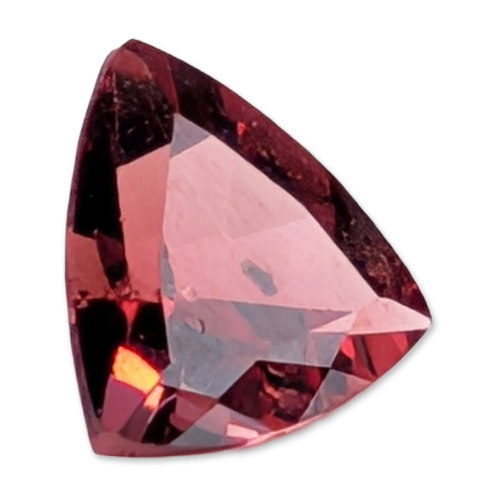 Trillion Cut Loose Garnet Gemstone: Loose faceted garnet gemstone, featuring a saturated purplish-red hue. The stone is worked into a trillion cut with slightly bowed sides and sharp corners. Faceting exhibits sharp junctions and