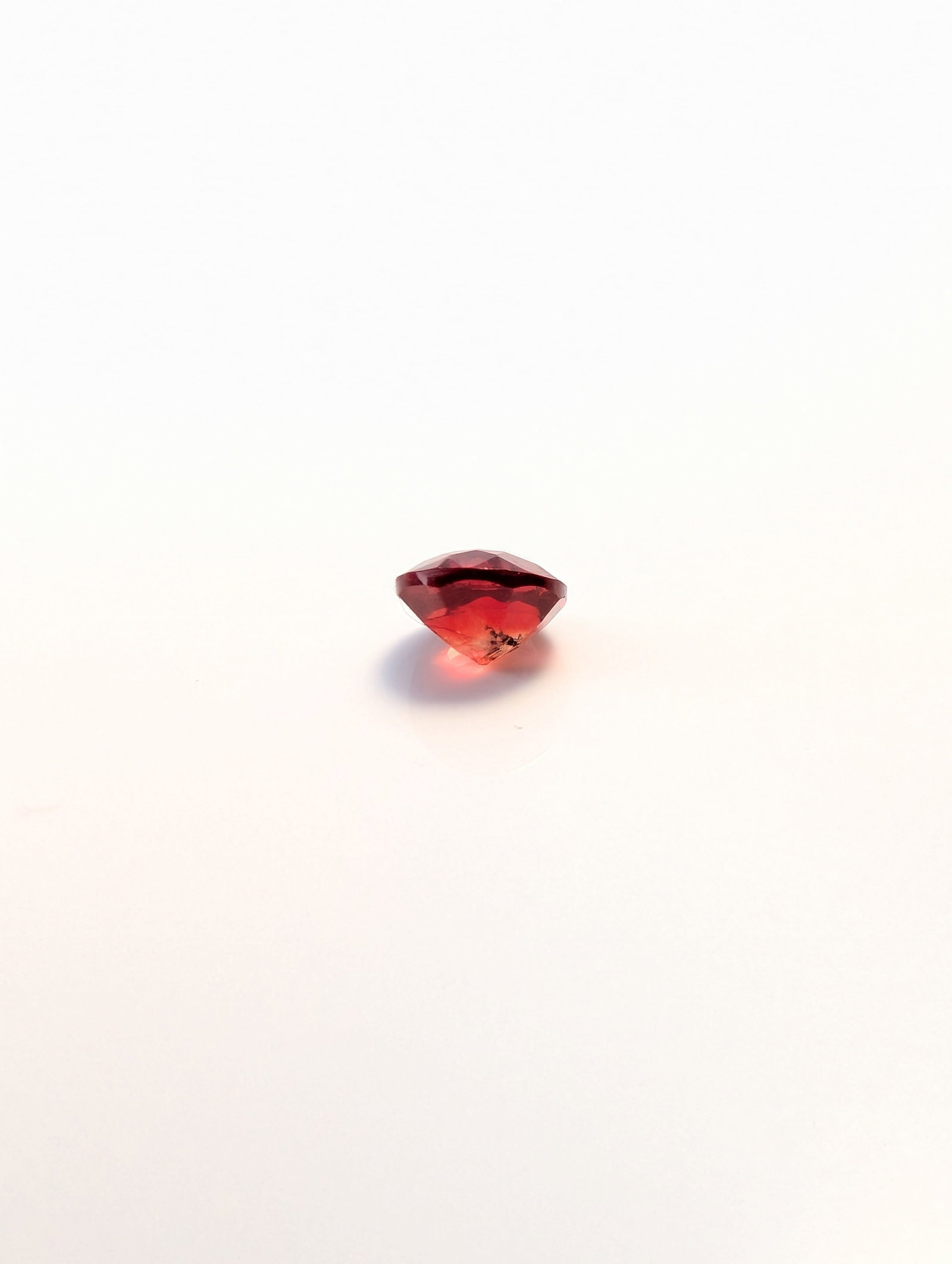 Faceted Round Orange-Red Gemstone - 2