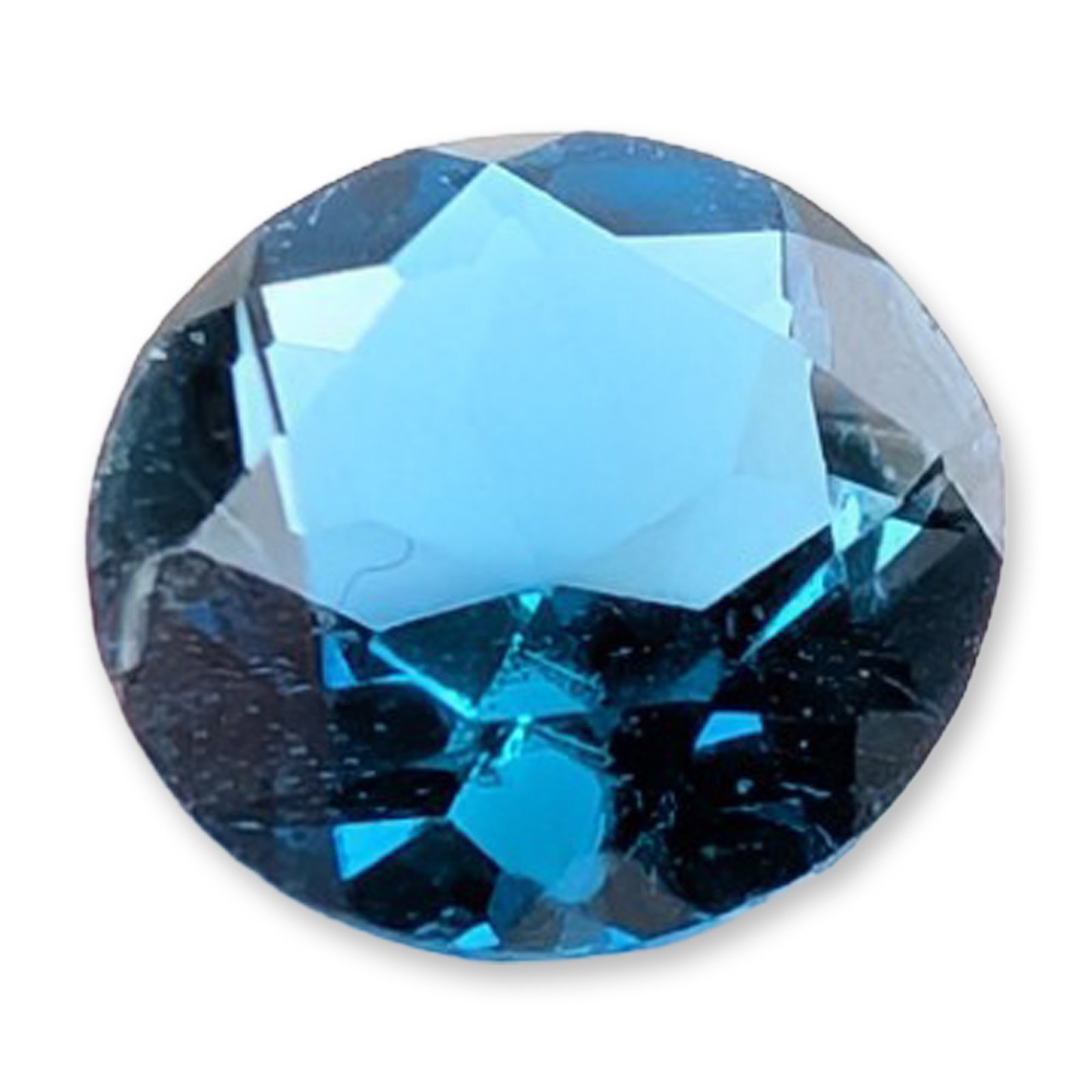 Round Brilliant Cut Blue Topaz Loose Gemstone: Loose faceted gemstone, appears to be London blue topaz. The stone features a deep, saturated blue hue with slight teal undertones and is fashioned in a round brilliant cut with a faceted crown and pa