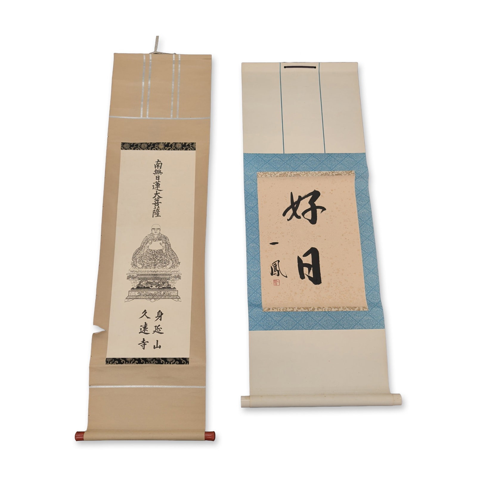 2pc Japanese Kakejiku Hanging Scrolls: Two Japanese hanging scrolls featuring calligraphic and Buddhist subjects. One Zen scroll presents two large characters in black ink on paper, reading Fine Day, with a vertical signature and a red squ