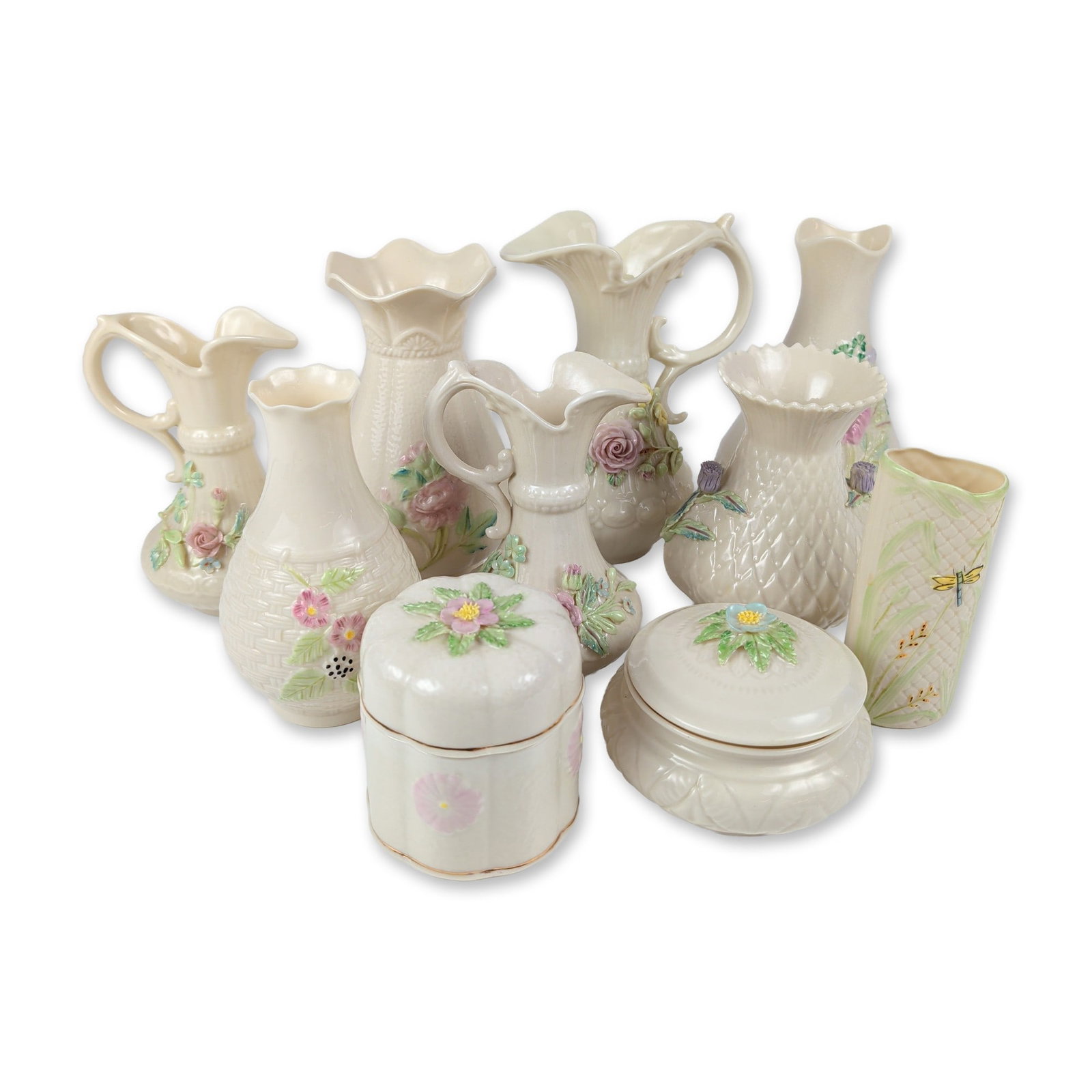 10pc Belleek Irish Parian Porcelain Collection: This fine collection of Belleek Irish Parian porcelain decorative items is finished in the brand's signature cream-colored iridescent lustre glaze. The grouping features an assortment of pitchers, vas