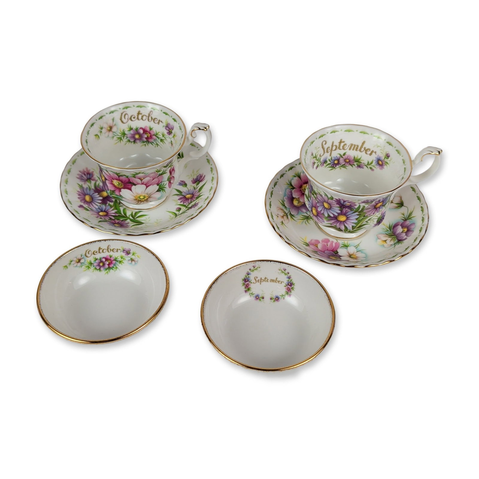 6pc Royal Albert Flower of the Month Bone China Grouping: Collection of six English fine bone china tableware pieces from the Flower of the Month series, featuring September and October floral patterns. The group includes two Montrose-form teacups with scrol