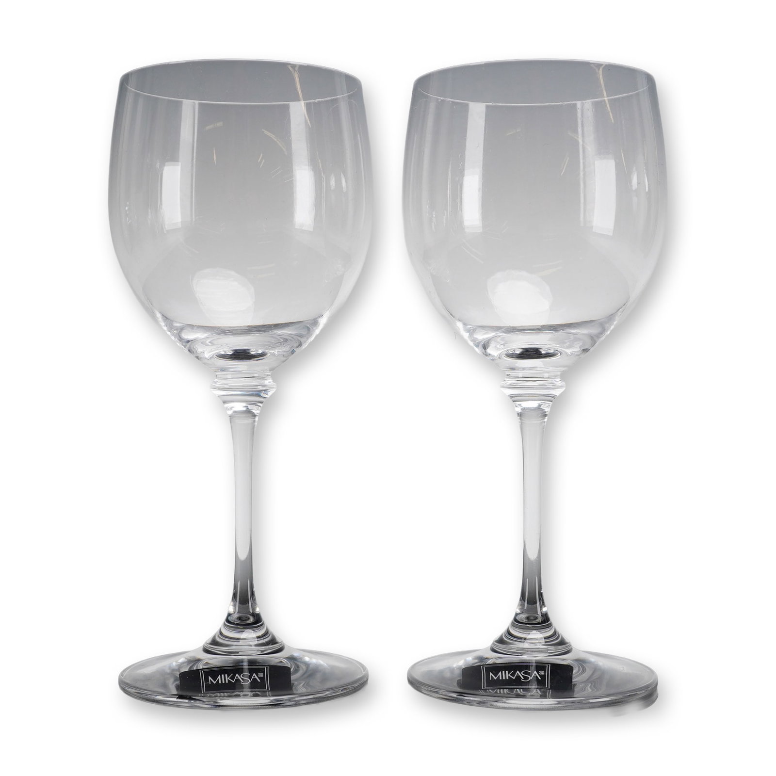 Pair of Mikasa Nicole Crystal Wine Glasses: A collectible highlighting Pair of Mikasa Nicole Crystal Wine Glasses. This pair of Mikasa crystal wine glasses is in the Nicole pattern. Each piece is manufactured from clear lead crystal and