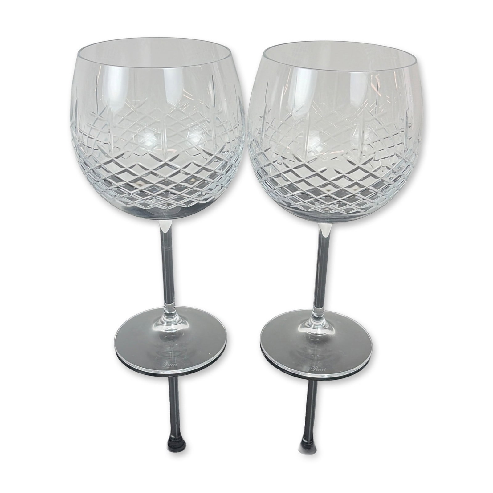 Pair of Ricci Cut Crystal Balloon Wine Glasses: Set of Ricci Argentieri cut crystal wine glasses. Each glass features a globular bowl decorated with a precision diamond cut pattern to the lower half, transitioning to a clear upper section. The
