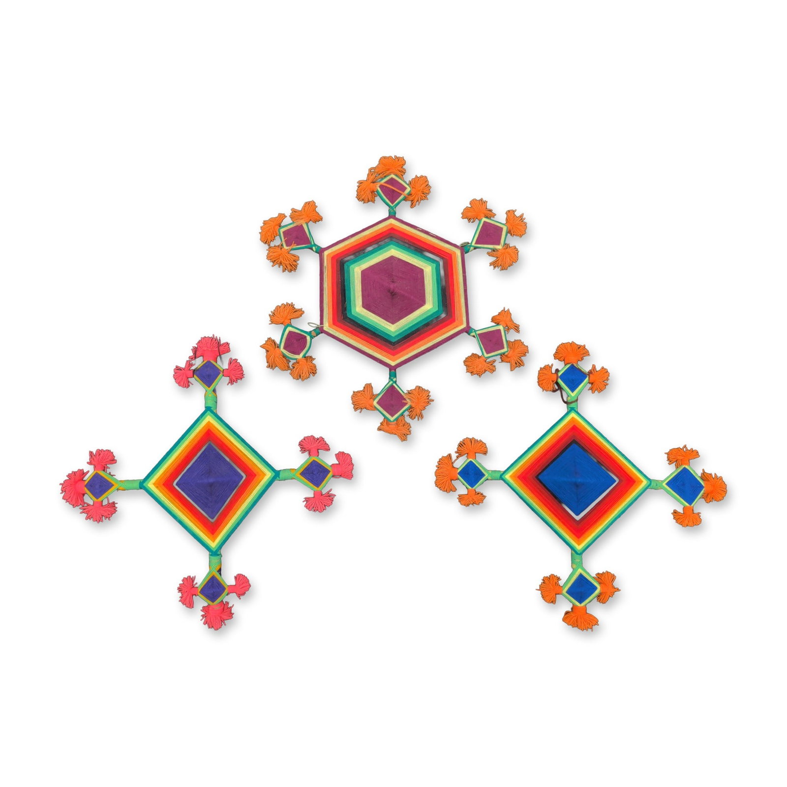 3pc Huichol Mexican Yarn Ojos de Dios: Huichol (Wixarika) folk art trio of Ojos de Dios, or Gods Eyes, featuring multicolored yarn hand-wrapped over wooden stick armatures in geometric patterns. The group consists of one hexagonal form