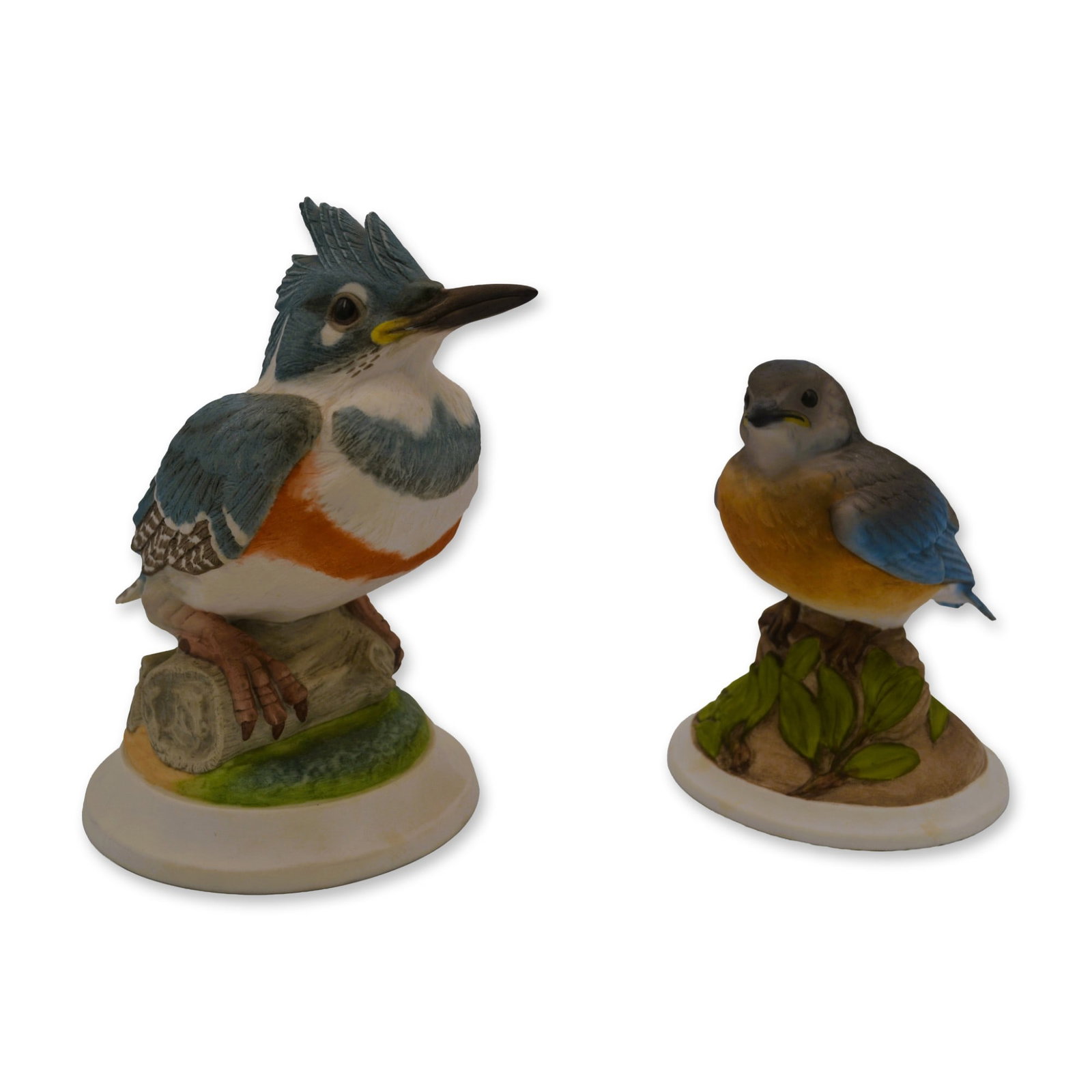 2Pc Bohem Porcelain Baby Blue Bird and Fledgling Kingfisher Bird Sculptures, 1958/1960: Bisque Porcelain Decorated, hand created, hand painted by Mr. Ed Boehm and the Artists at the Boehm Studios in Trenton, New Jersey, USA. Featuring the 1) Baby Blue Bird on a circular base, introduced 