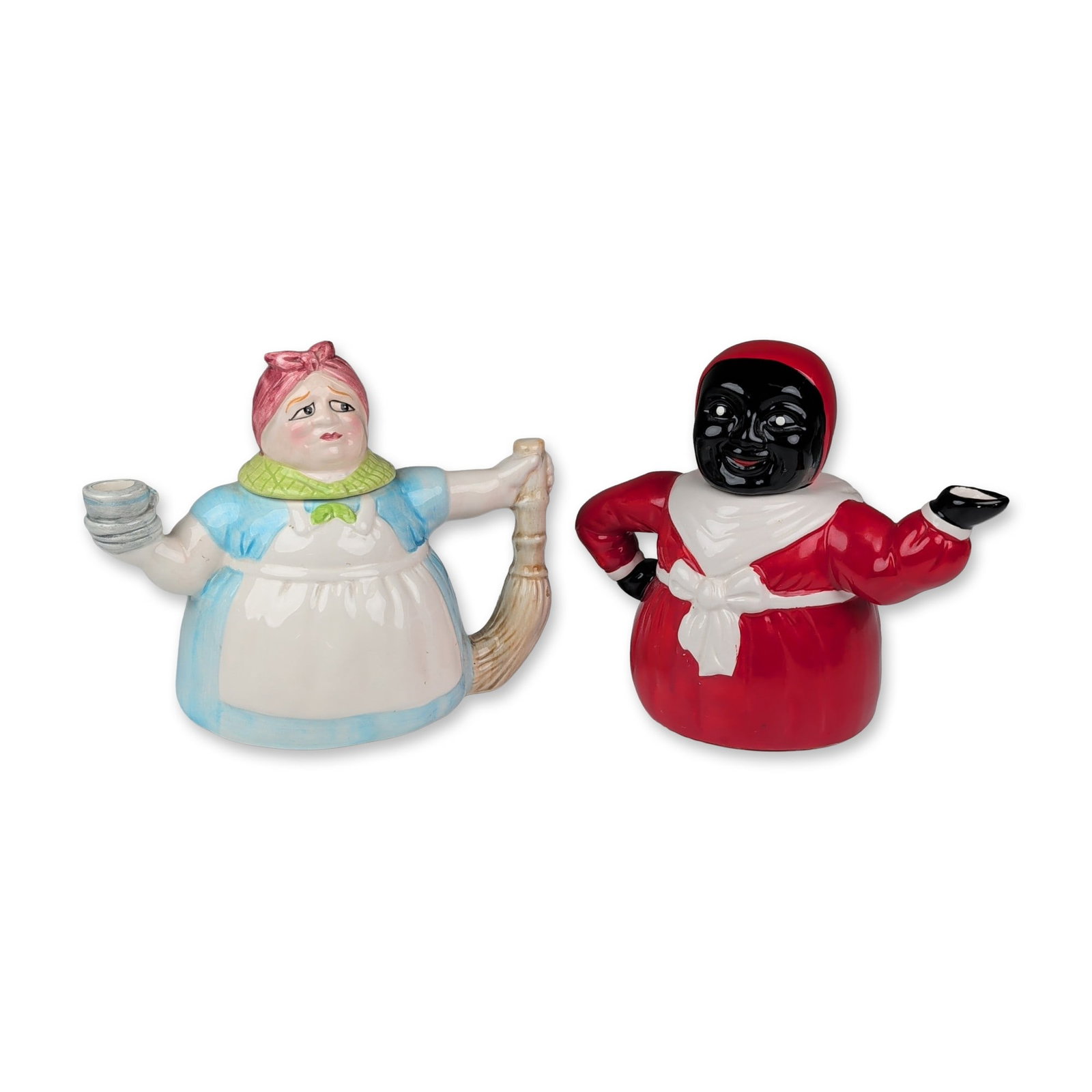 2pc Mid-Century Ceramic Figural Novelty Teapots: The first teapot is an earthenware figure of a maid wearing a blue bodice, white apron, and green checkered collar. The lid is modeled as a head with a pink headscarf and a weary facial expression.