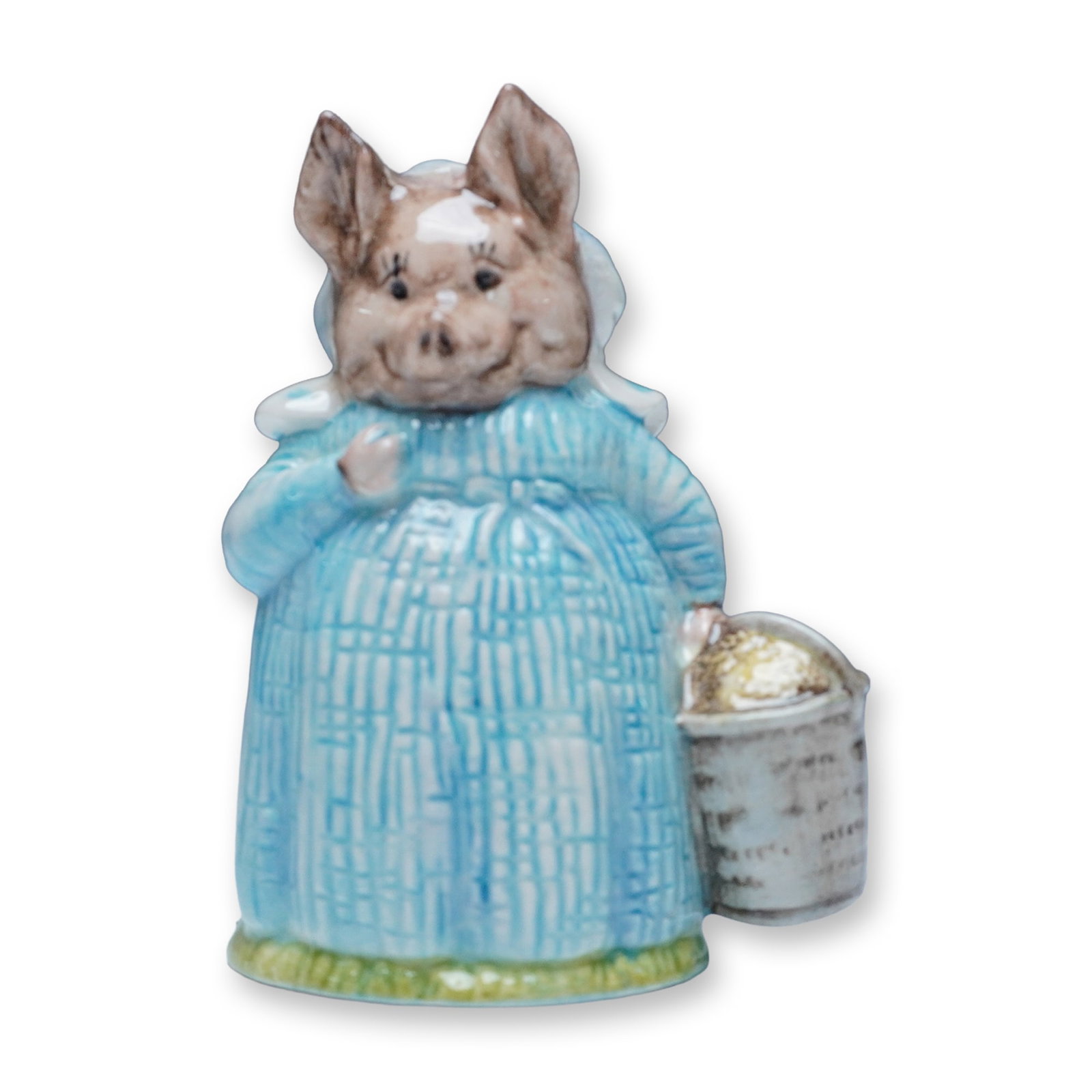 Royal Albert Beatrix Potter Aunt Pettitoes Figurine: A delightful Royal Albert porcelain figurine of Aunt Pettitoes, the charming pig character from Beatrix Potter's beloved tales. This finely crafted figurine features Aunt Pettitoes in a textured blue 
